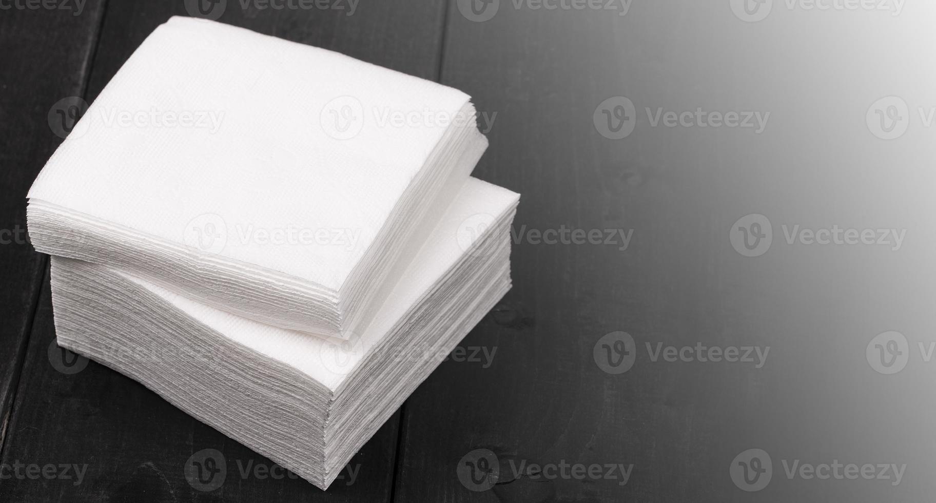 white paper napkins on wooden background Close up photo