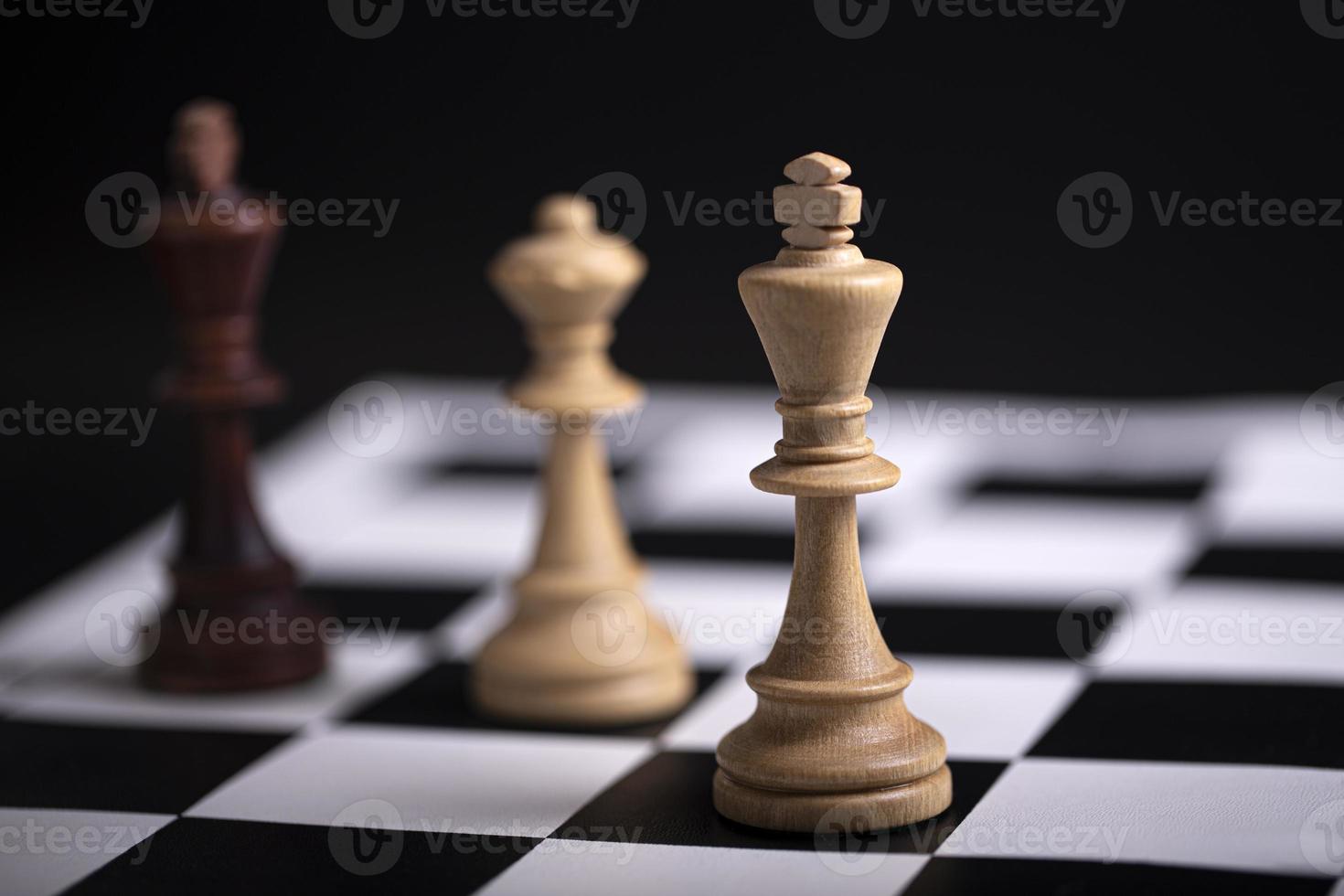 Chess pieces on a chessboard. The concept of playing and winning a chess tournament photo