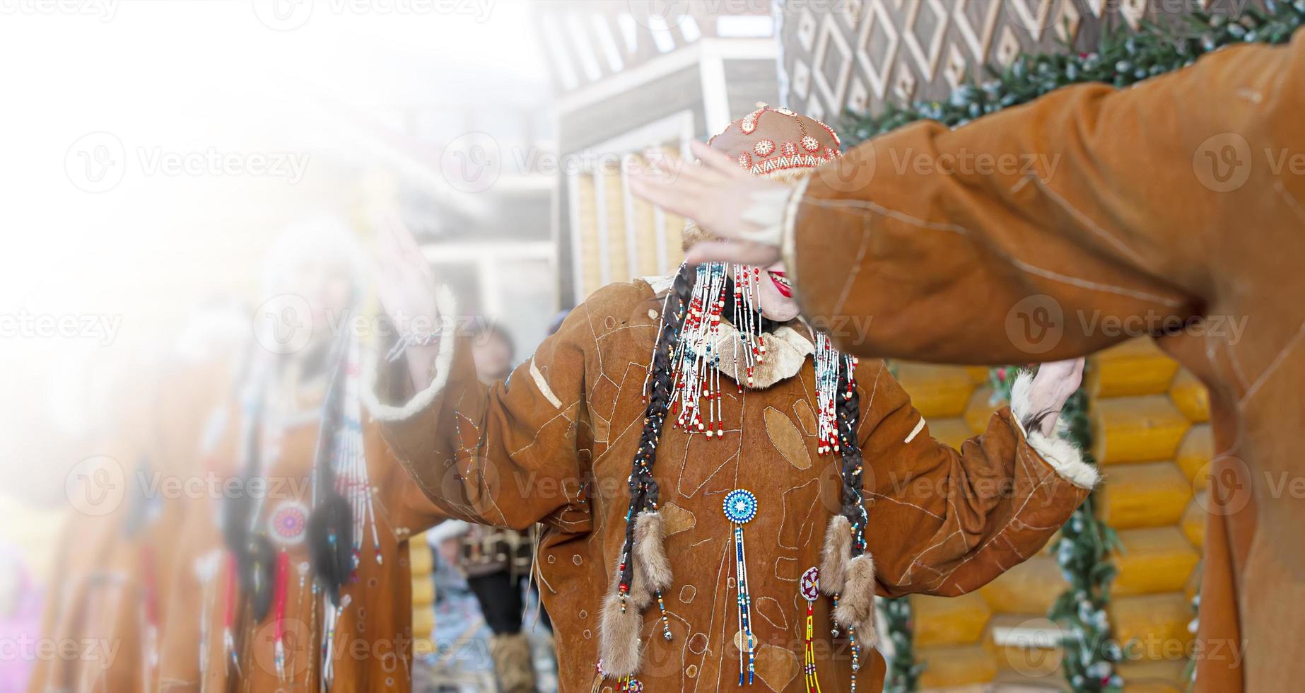 Folk ensemble performance in dress of indigenous people of Kamchatka. Selective focus photo