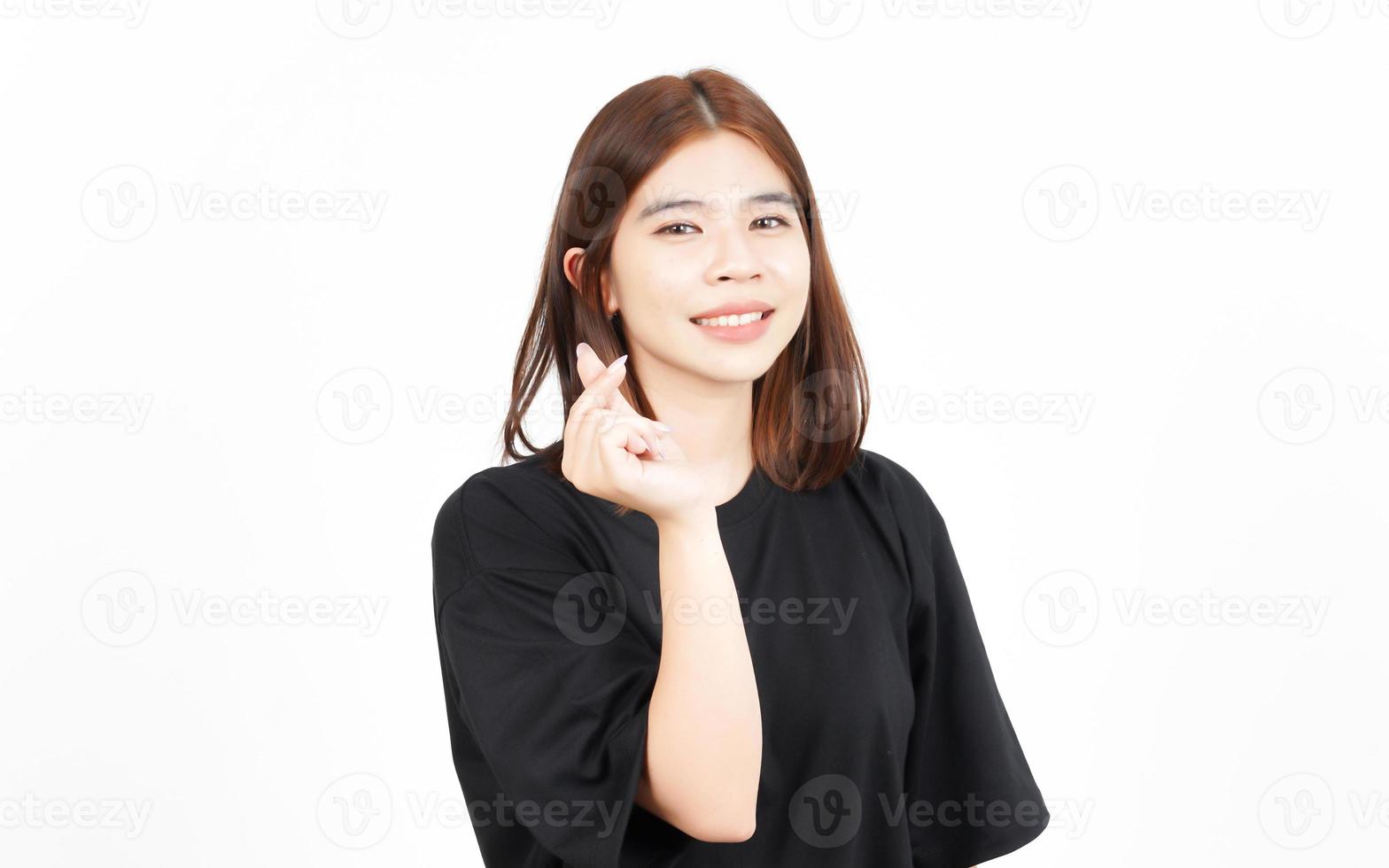 Showing Korean love finger Of Beautiful Asian Woman Isolated On White Background photo