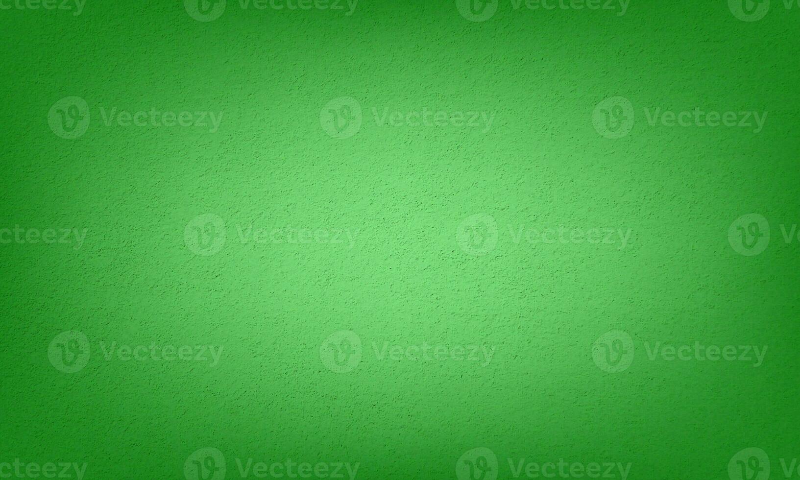 Abstract grungy forest green gradient color stucco wall background photo