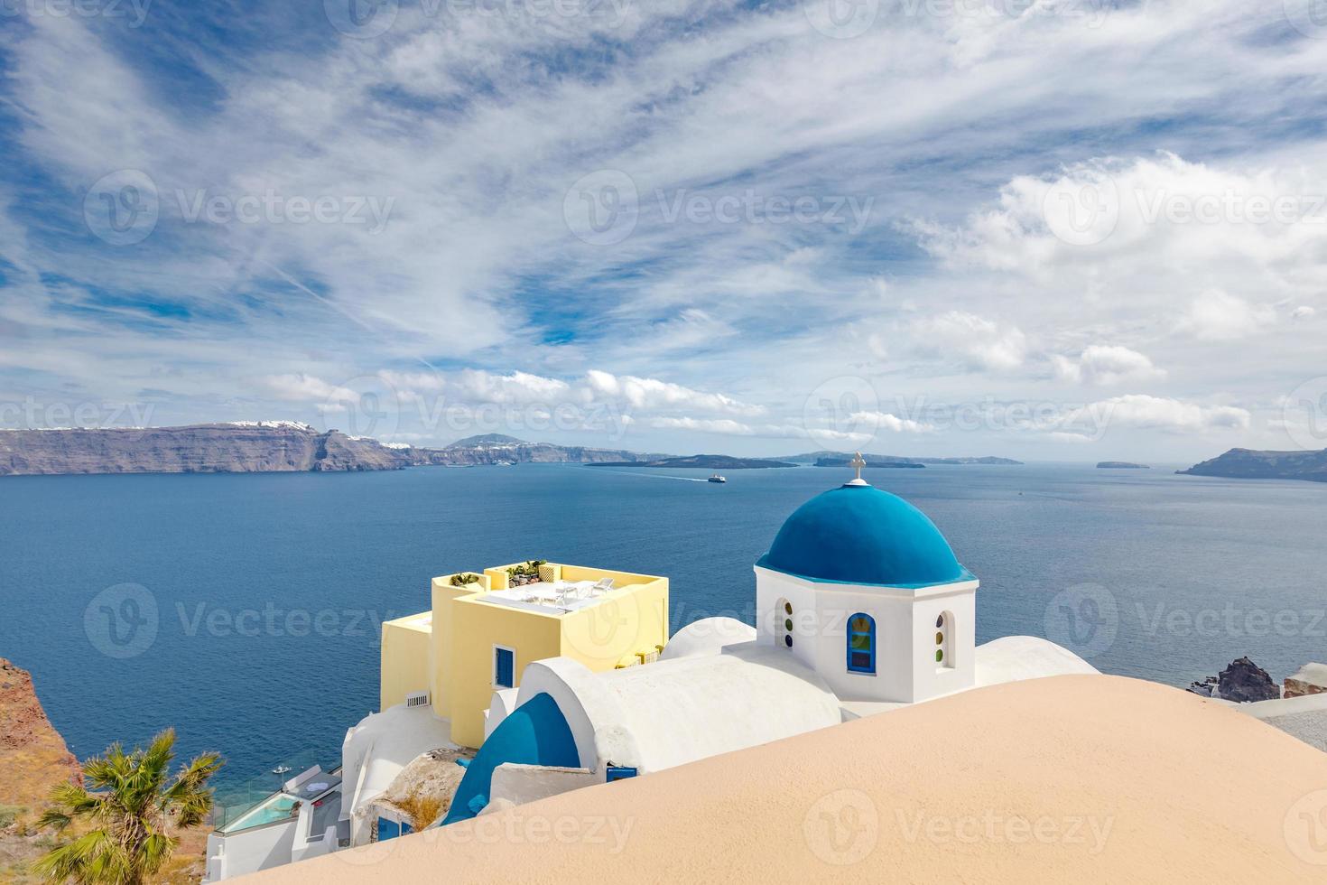 Panoramic view of Oia town, Santorini island, Greece. Beautiful landscape with sea view. White church and volcano view, summer travel landscape photo
