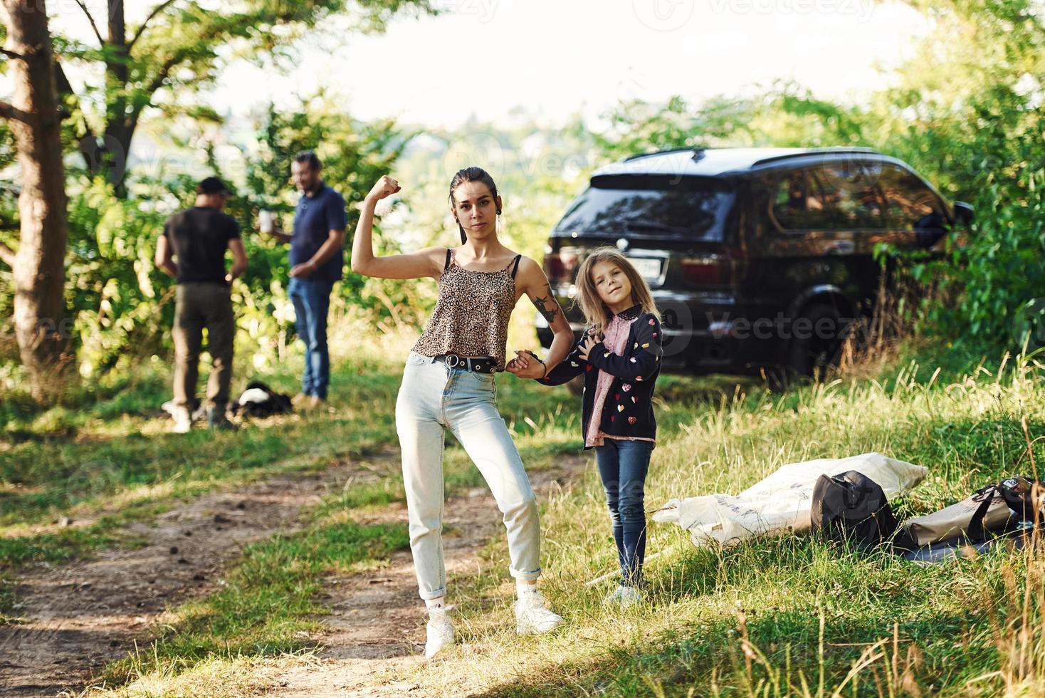 Mom and daughter outdoors photo