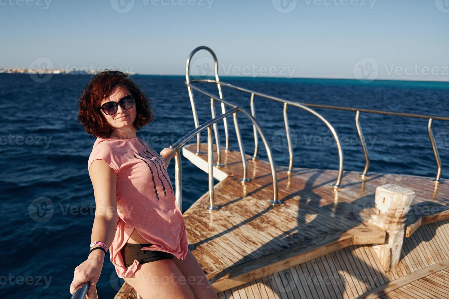Woman posing on a boat photo