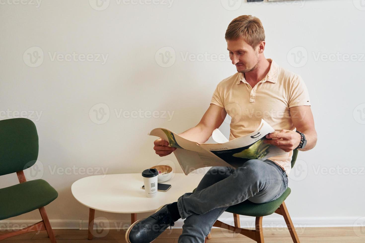 Man reading a newspaper photo