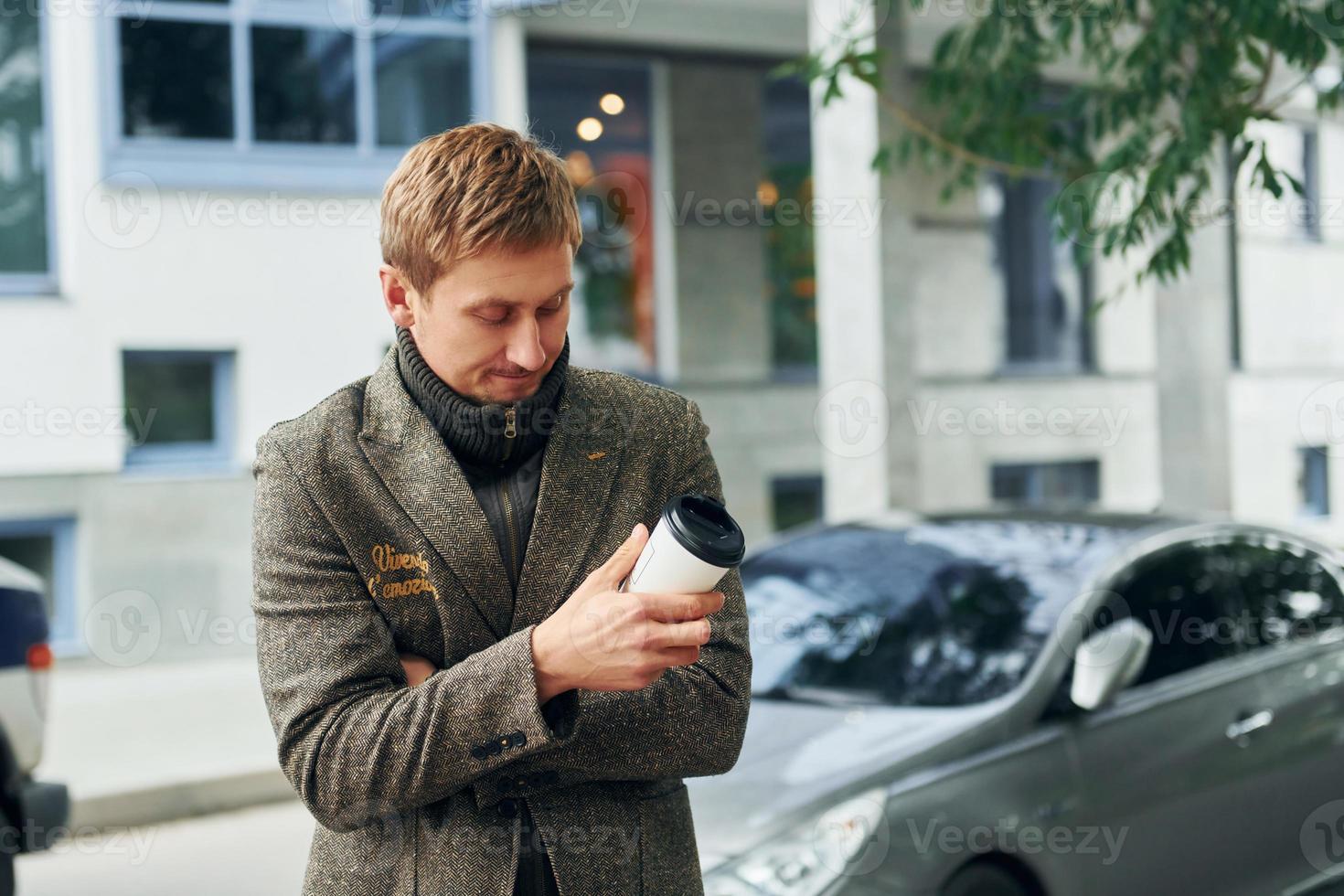 Man having coffee outside photo