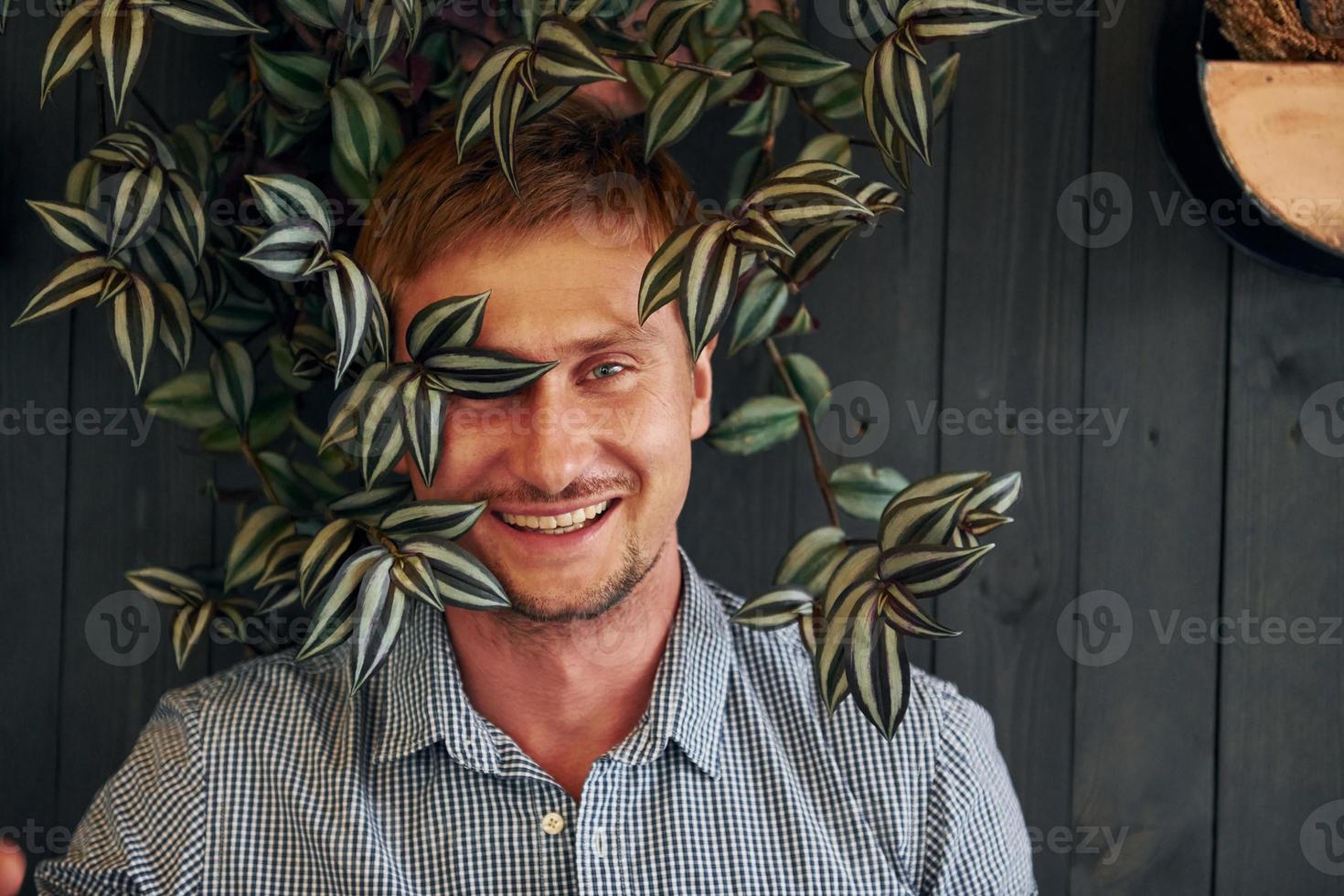 Handsome man with plants photo