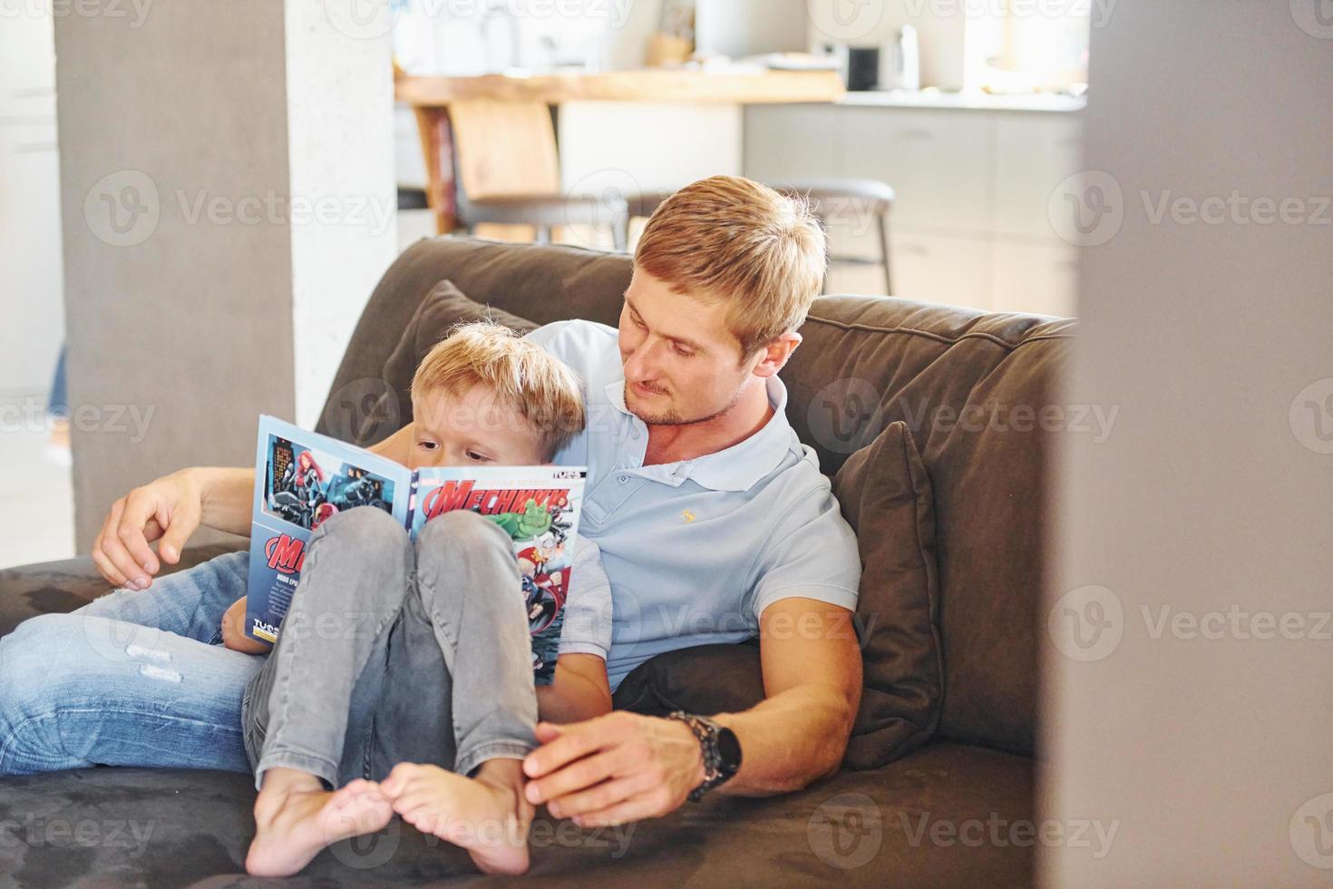 Father and son reading together photo