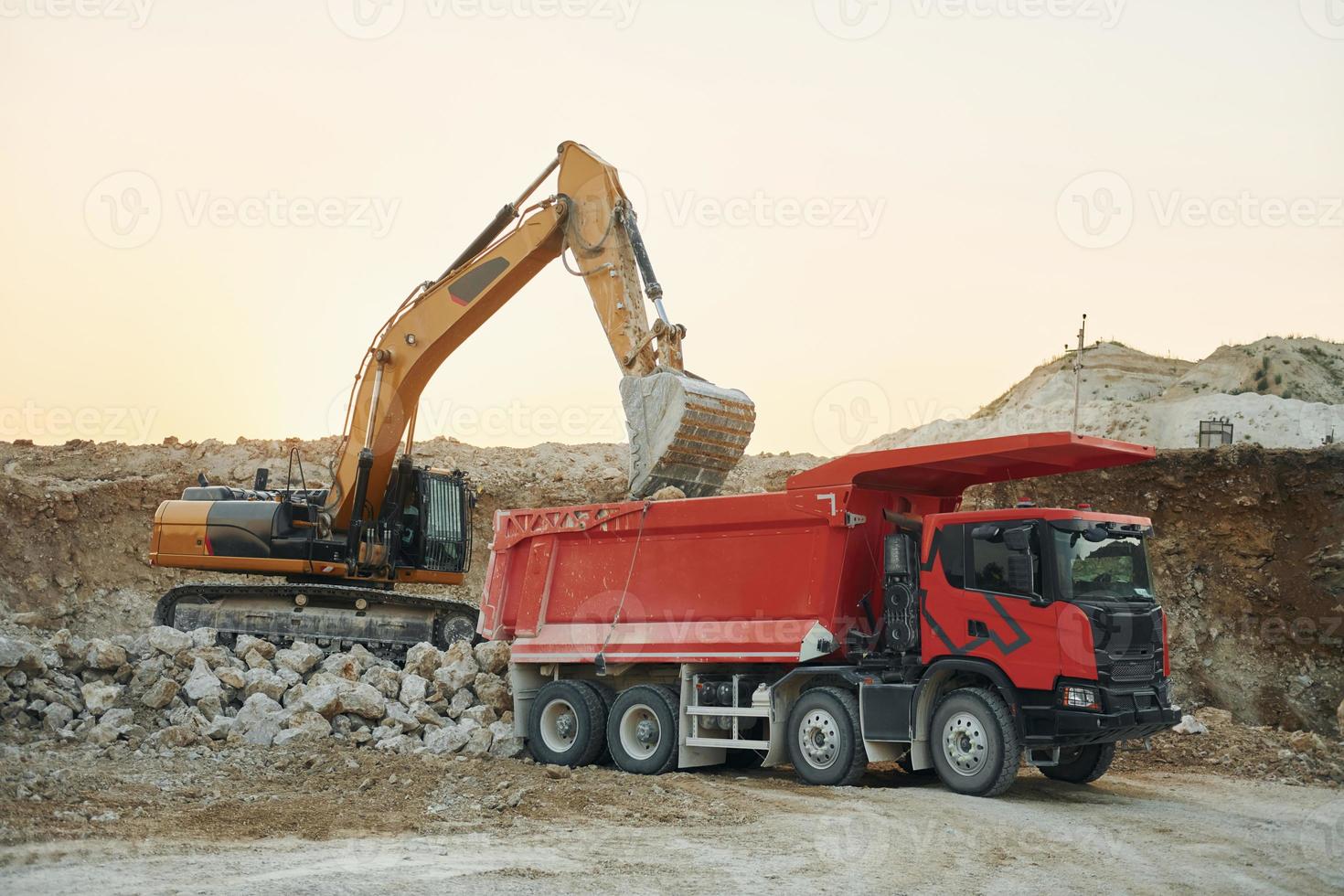 Loading vehicle is outdoors on the borrow pit at daytime photo