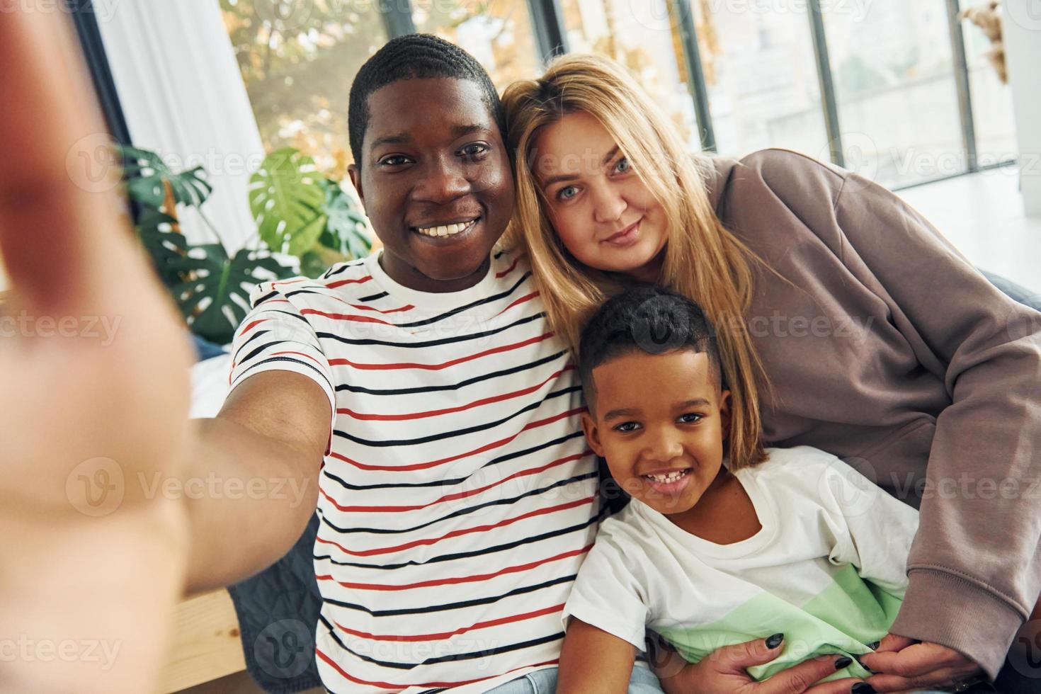 Mixed race family together photo