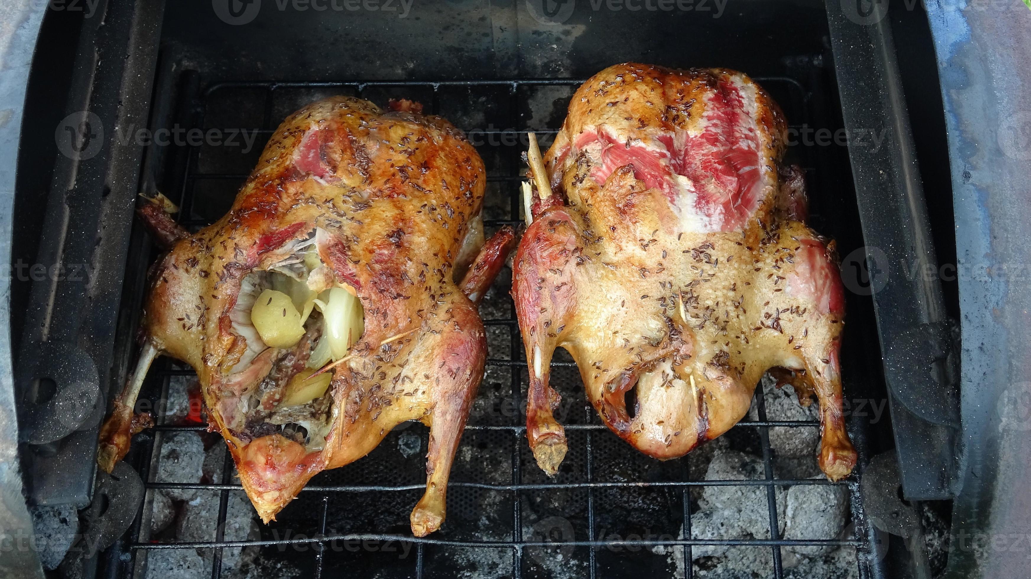 Barbecue duck grilling, cooking food 16937798 Stock Photo at Vecteezy