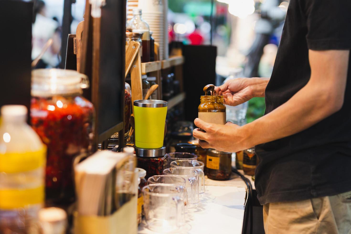 Man making immunity boosting drink with turmeric health care concept. photo