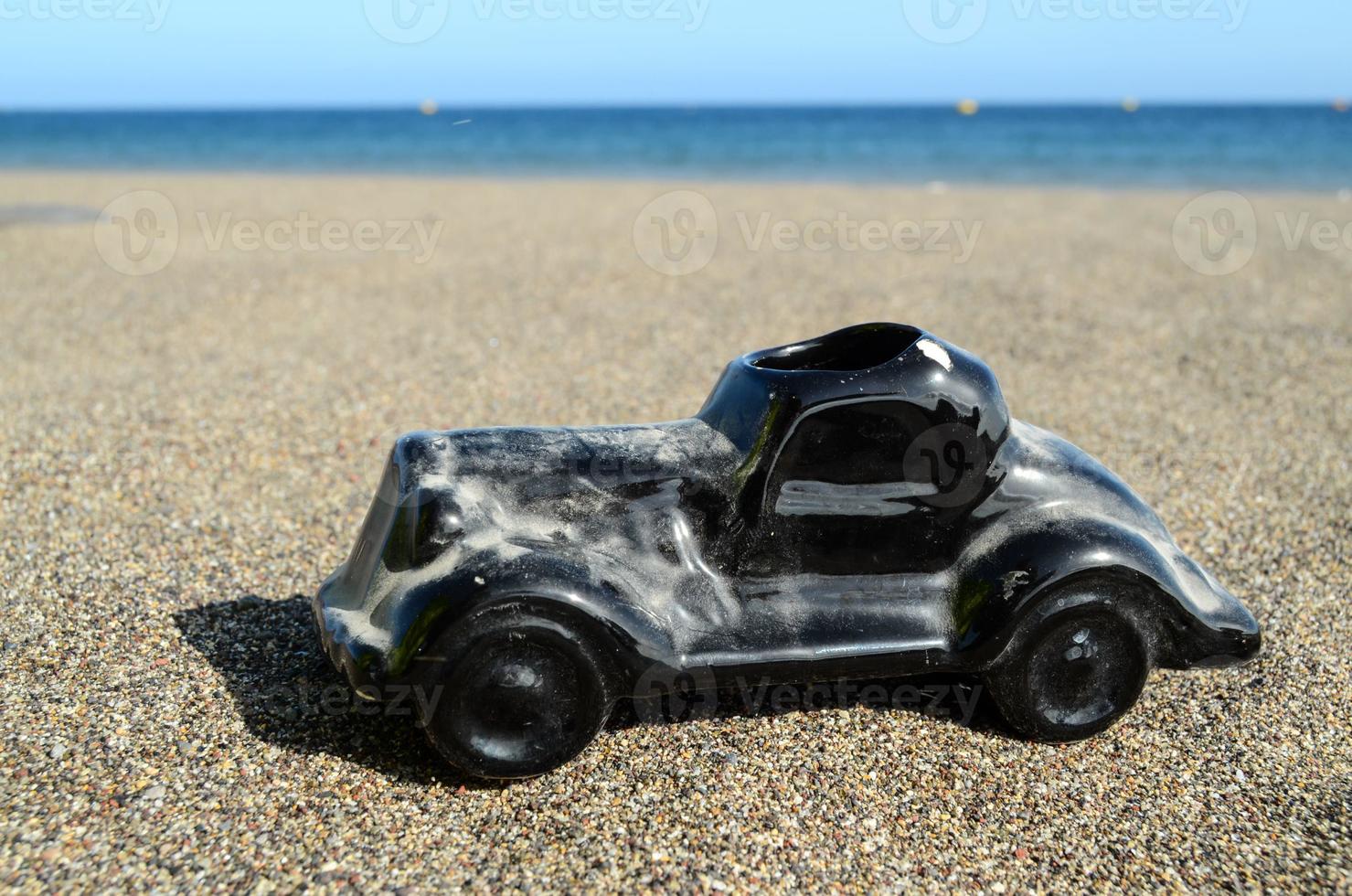 Toy car on the beach photo