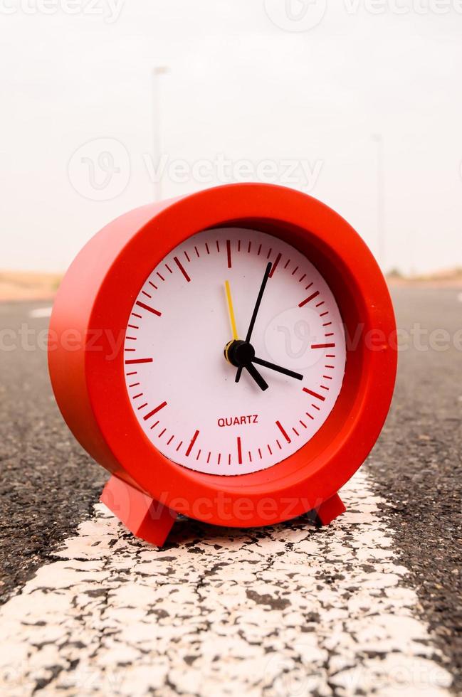 Clock on the road photo