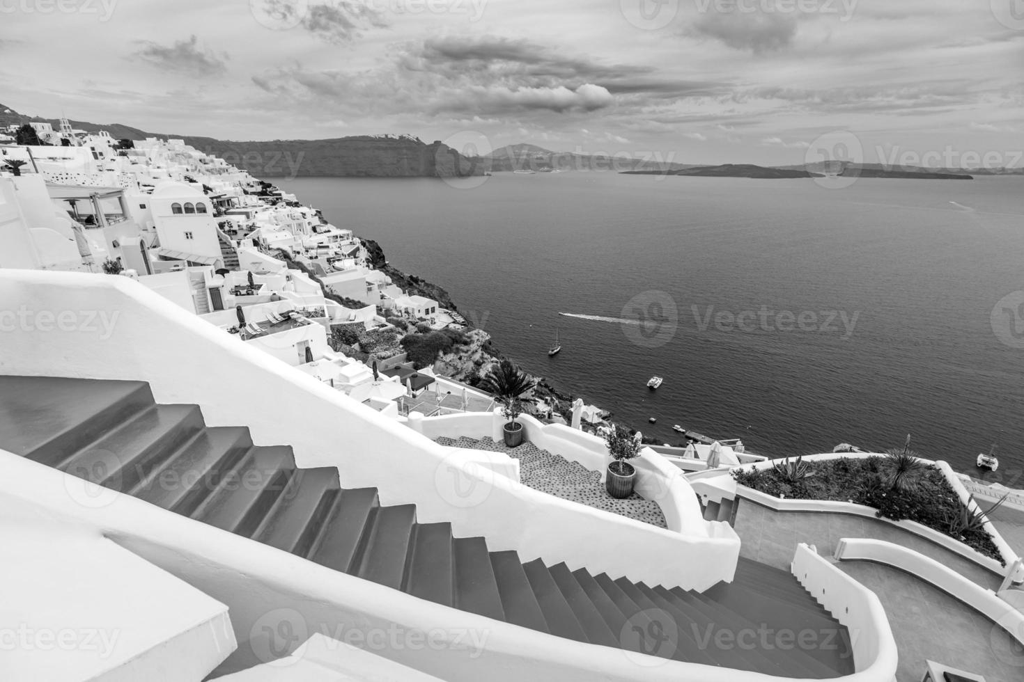 Classical view in Oia village on Santorini volcano island in Greece. Dramatic process, black and white photo. Caldera sea view, idyllic landscape photo