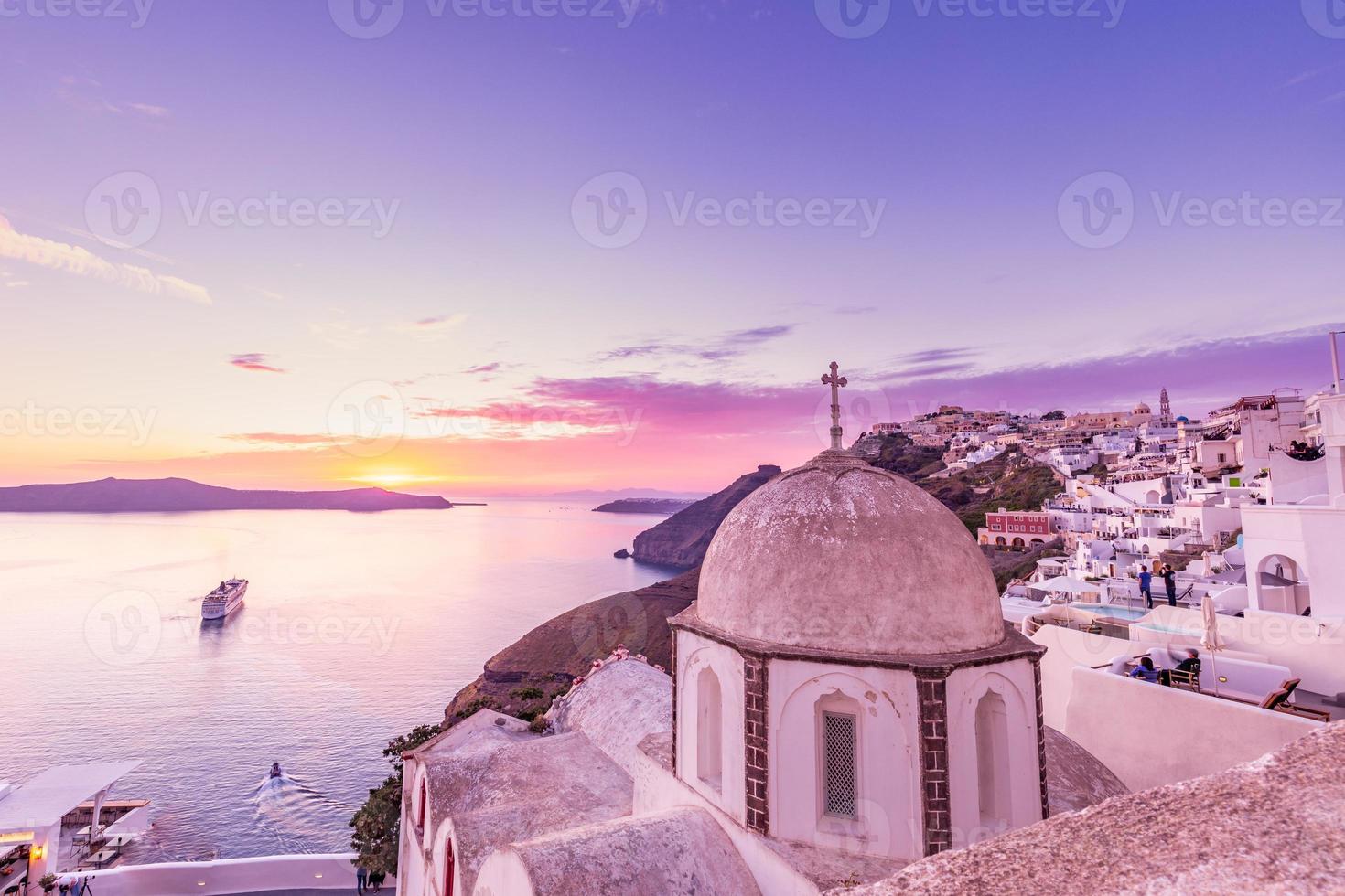 Romantic Santorini island during sunset, Greece, Europe. Wonderful sunset scenery, amazing dramatic colorful sky, peaceful nature beauty. photo