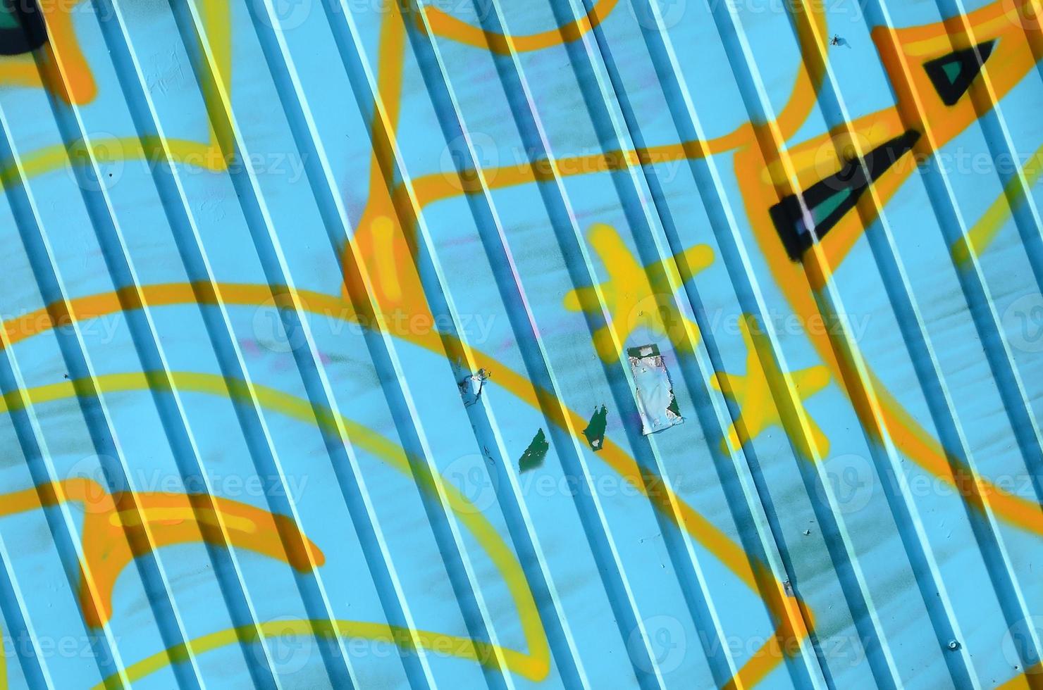 Fragment of graffiti drawings. The old wall decorated with paint stains in the style of street art culture. Colored background texture in cold tones photo