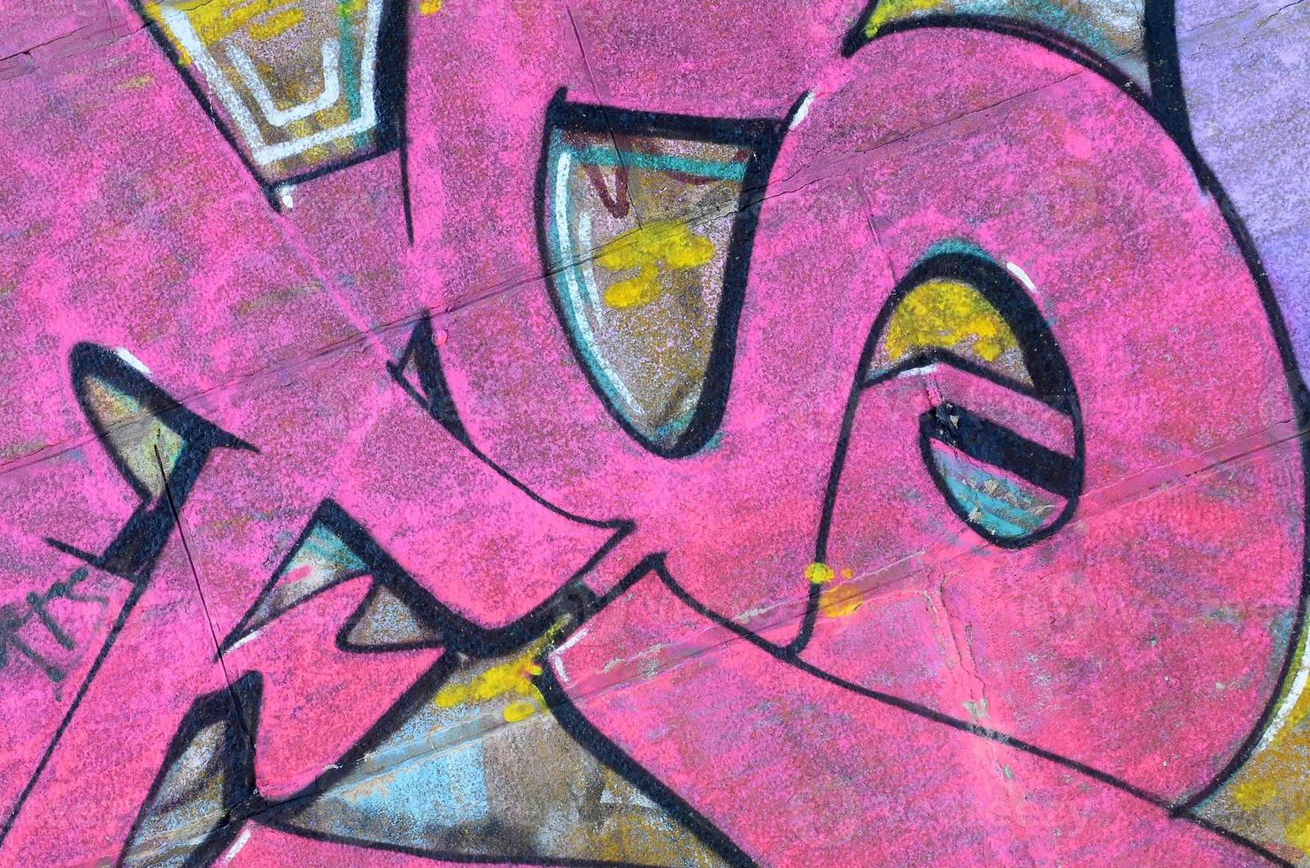 Fragment of graffiti drawings. The old wall decorated with paint stains in the style of street art culture. Colored background texture in purple tones photo