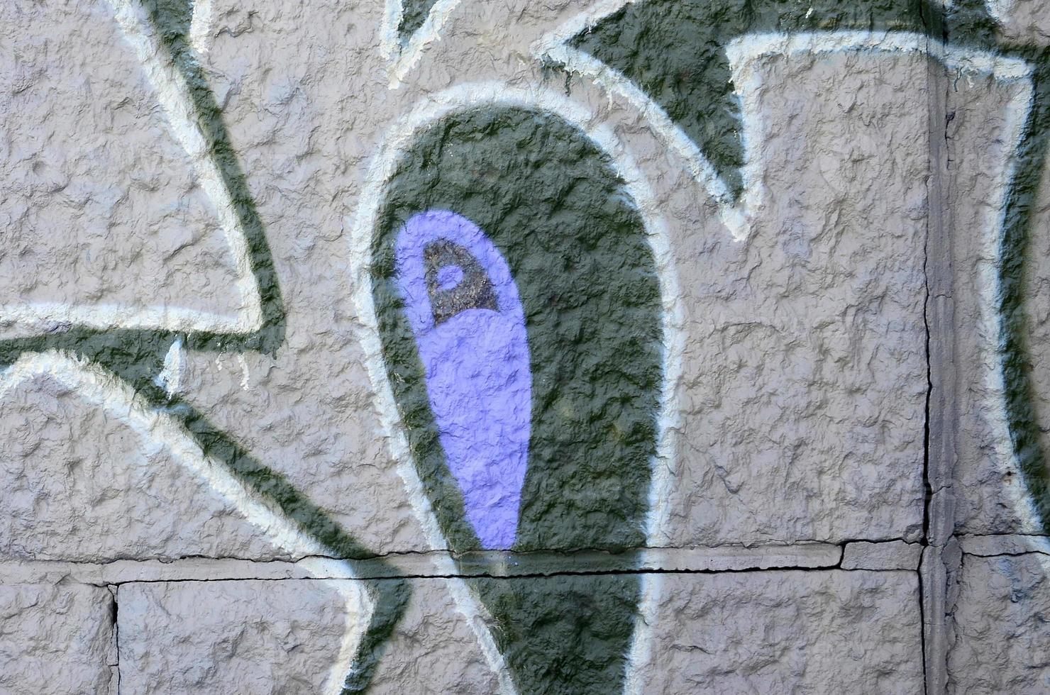 Fragment of graffiti drawings. The old wall decorated with paint stains in the style of street art culture. Colored background texture in purple tones photo