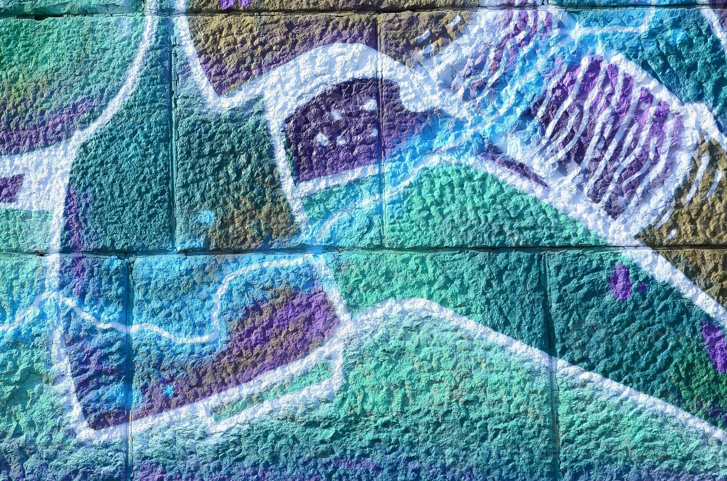 Fragment of graffiti drawings. The old wall decorated with paint stains in the style of street art culture. Colored background texture in cold tones photo