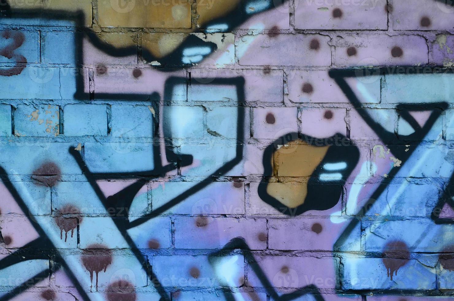 Fragment of graffiti drawings. The old wall decorated with paint stains in the style of street art culture. Colored background texture in cold tones photo