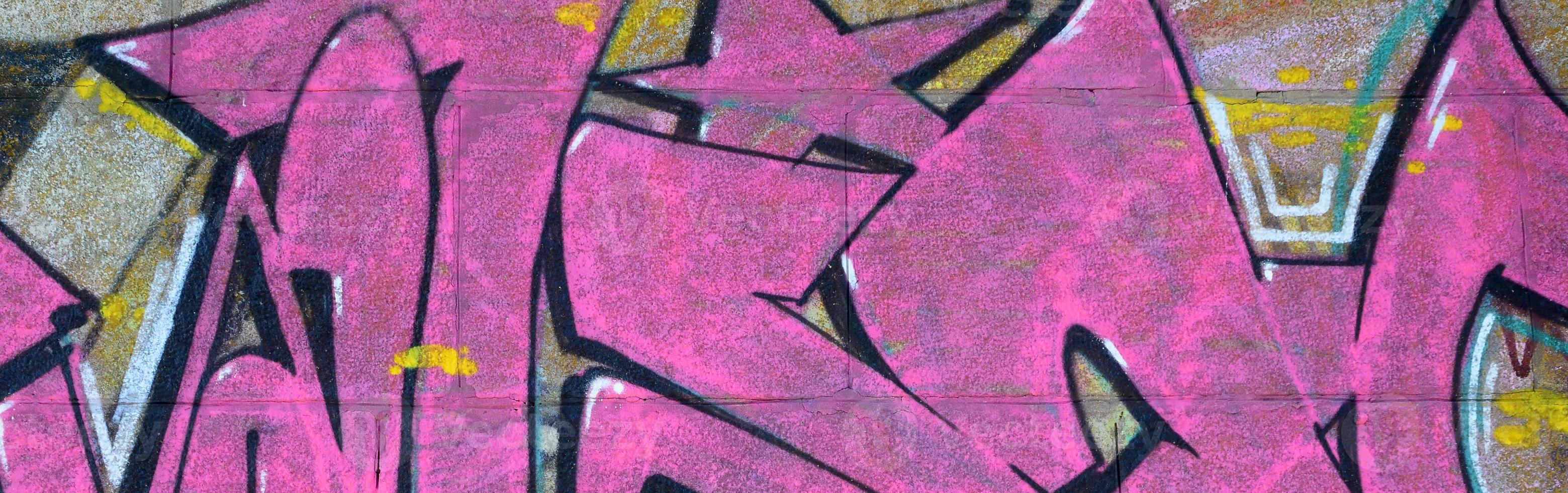 Fragment of graffiti drawings. The old wall decorated with paint stains in the style of street art culture. Colored background texture in purple tones photo