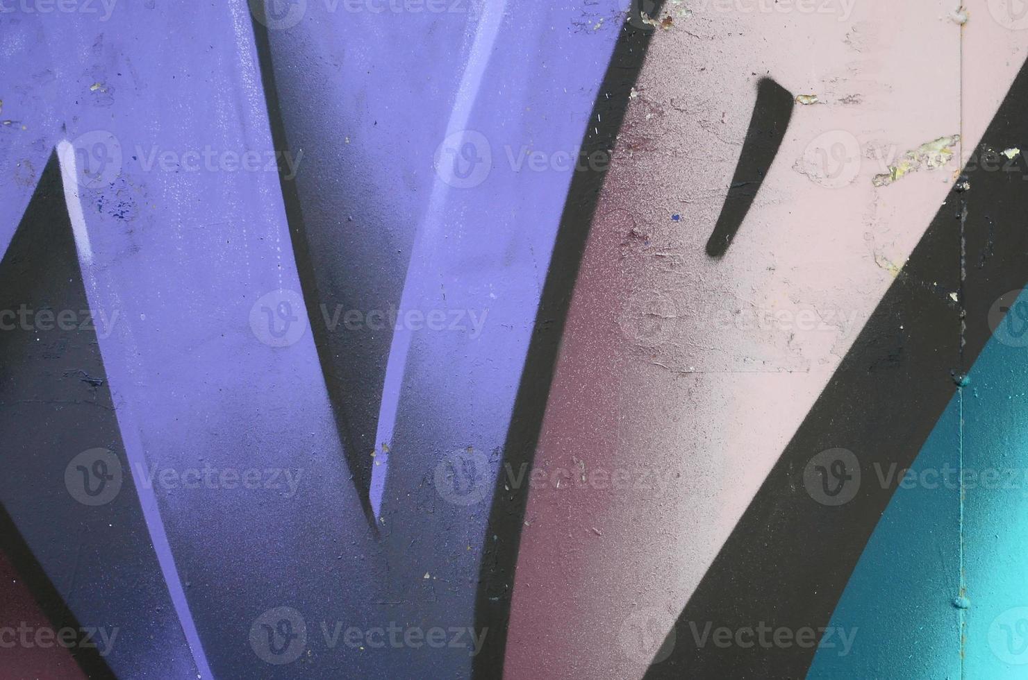 Fragment of graffiti drawings. The old wall decorated with paint stains in the style of street art culture. Colored background texture in cold tones photo