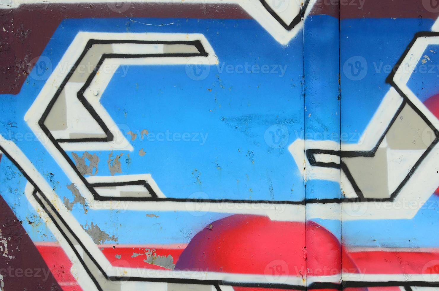 fragmento de dibujos de graffiti. la antigua muralla decorada con manchas de pintura al estilo de la cultura del arte callejero. textura de fondo coloreada en tonos fríos foto