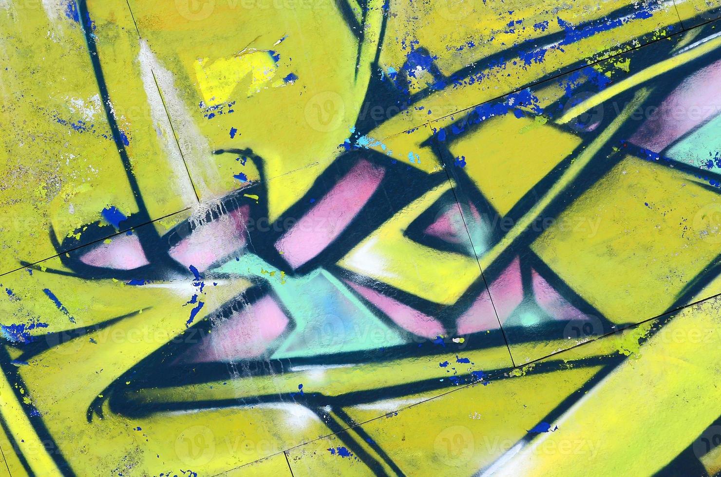 Fragment of graffiti drawings. The old wall decorated with paint stains in the style of street art culture. Colored background texture in green tones photo