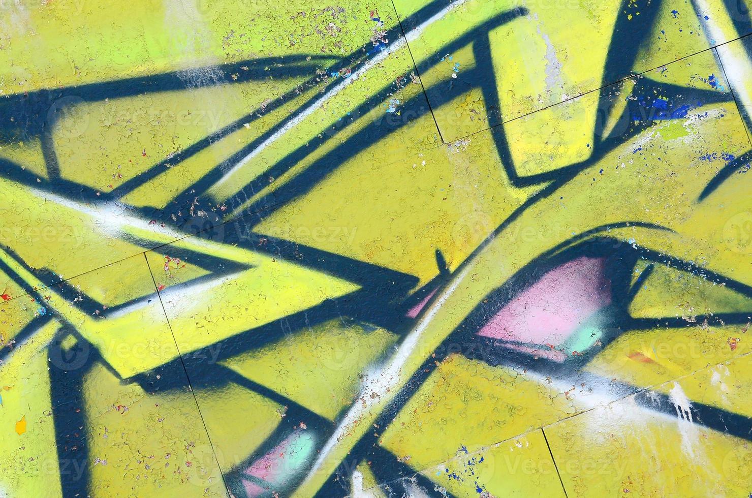 Fragment of graffiti drawings. The old wall decorated with paint stains in the style of street art culture. Colored background texture in green tones photo