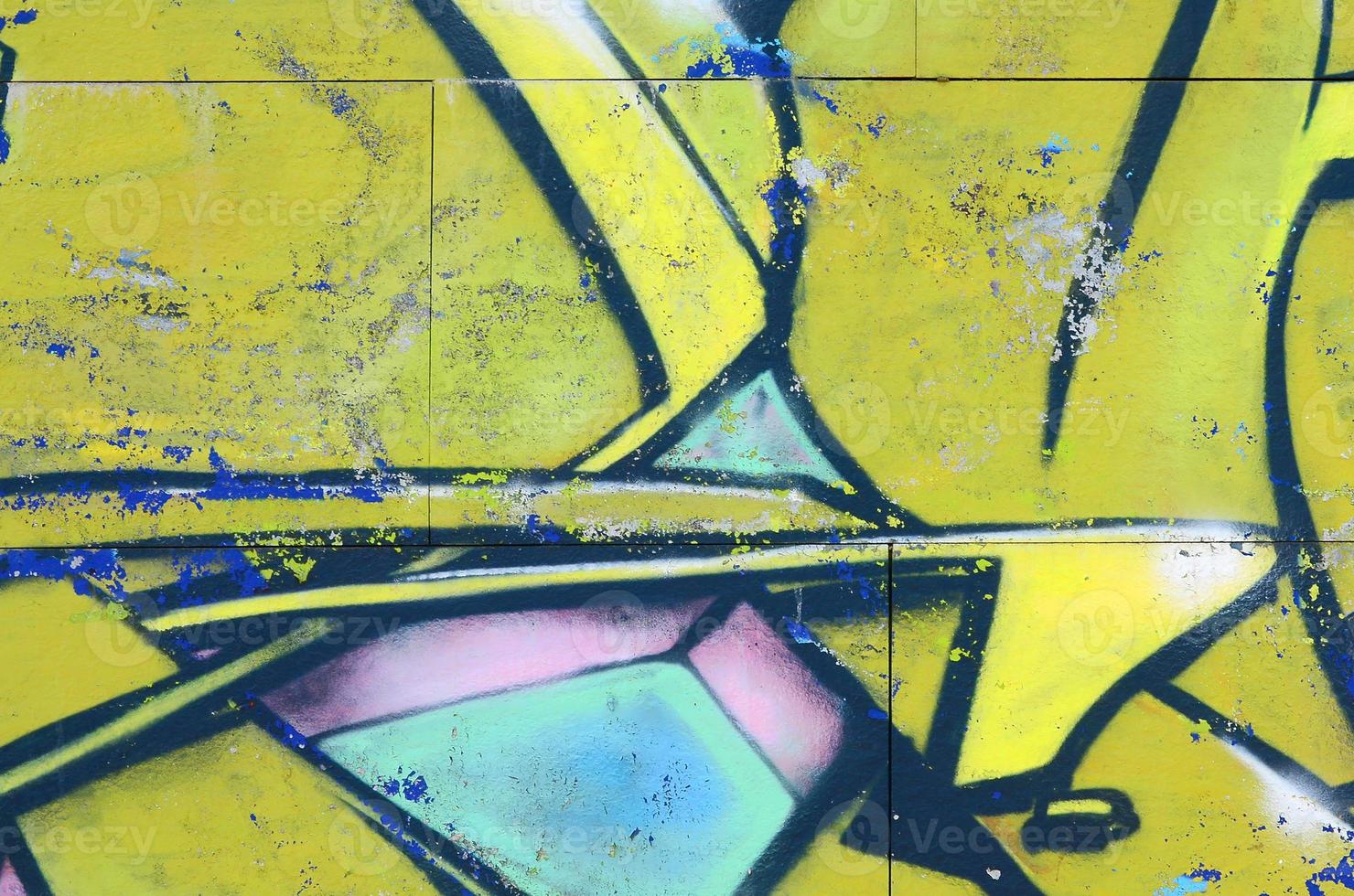 Fragment of graffiti drawings. The old wall decorated with paint stains in the style of street art culture. Colored background texture in green tones photo