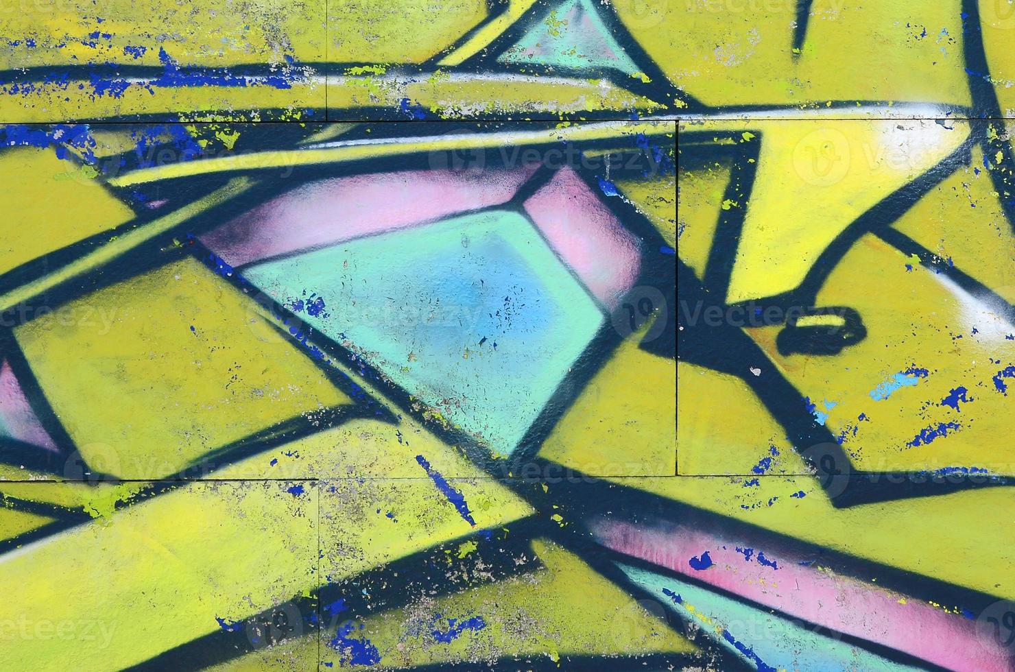 Fragment of graffiti drawings. The old wall decorated with paint stains in the style of street art culture. Colored background texture in green tones photo