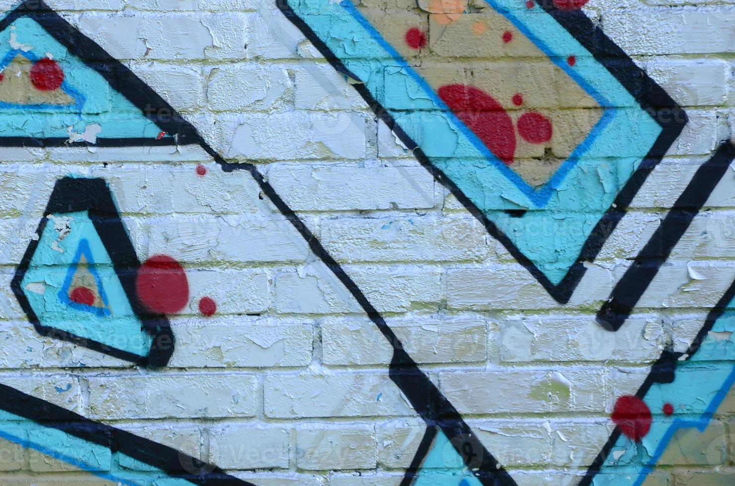 Fragment of graffiti drawings. The old wall decorated with paint stains in the style of street art culture. Colored background texture in cold tones photo