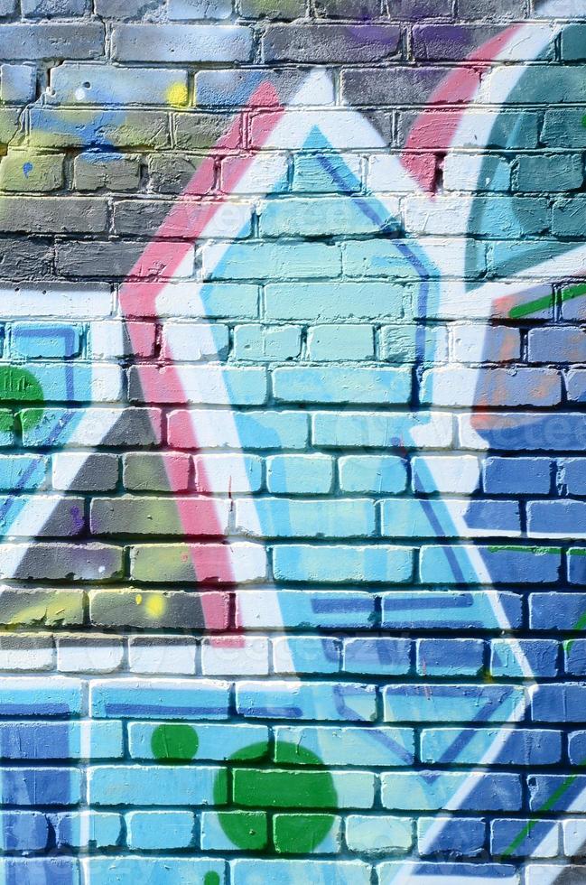 Fragment of graffiti drawings. The old wall decorated with paint stains in the style of street art culture. Colored background texture in cold tones photo