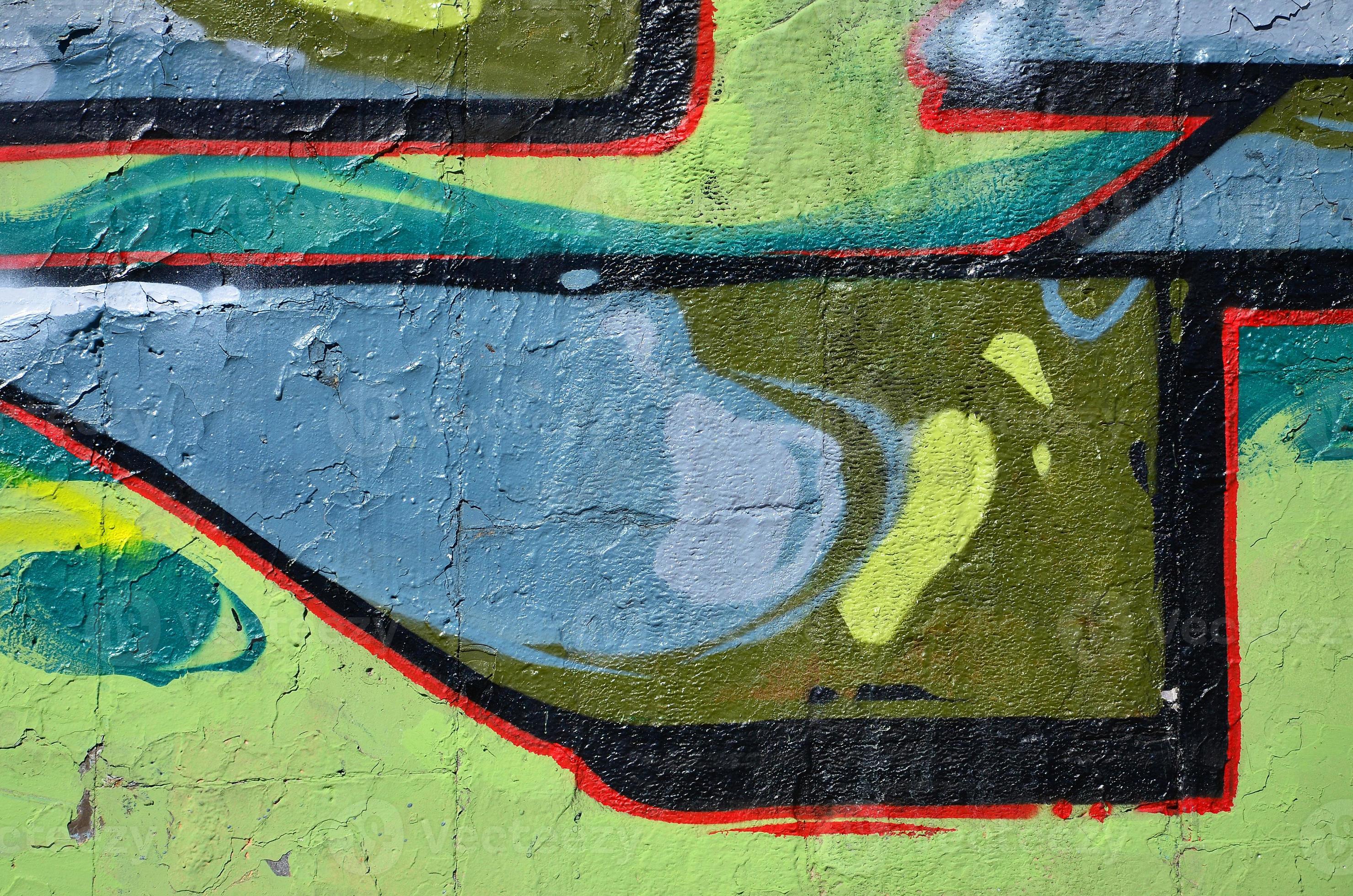 Fragment of an old colored graffiti drawing on the wall. Background