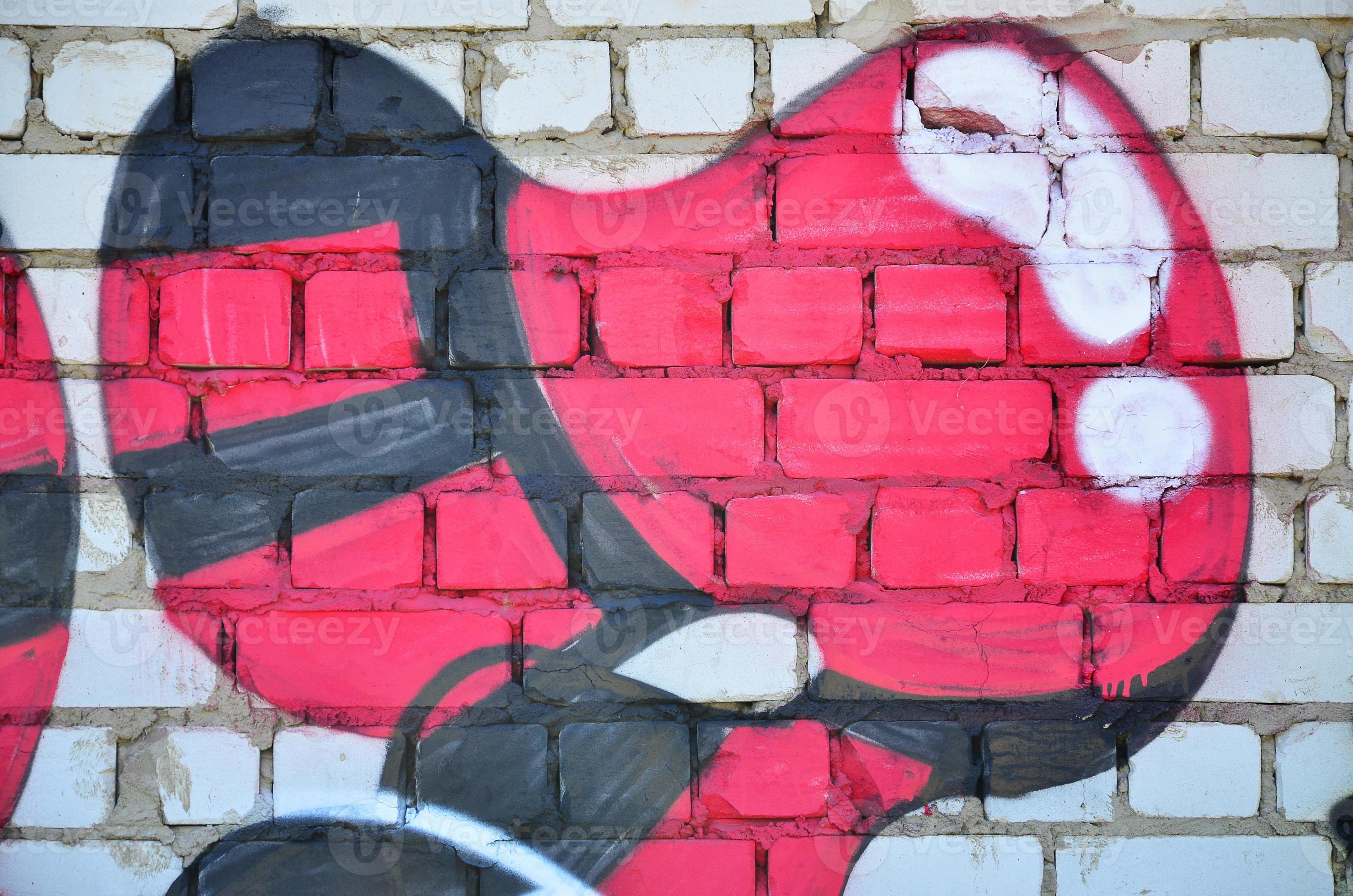 Fragment of an old colored graffiti drawing on the wall. Background