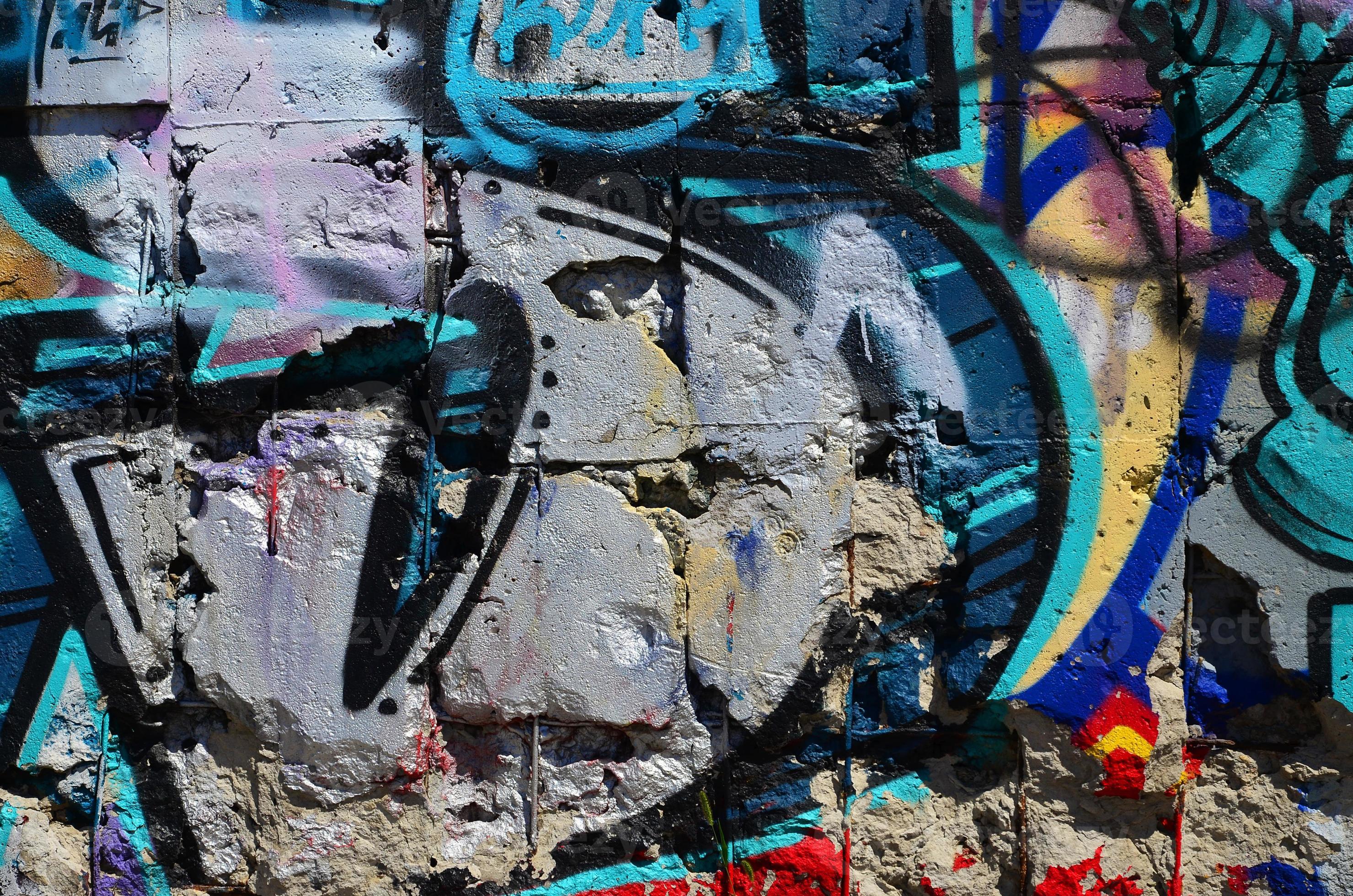 Fragment of an old colored graffiti drawing on the wall. Background