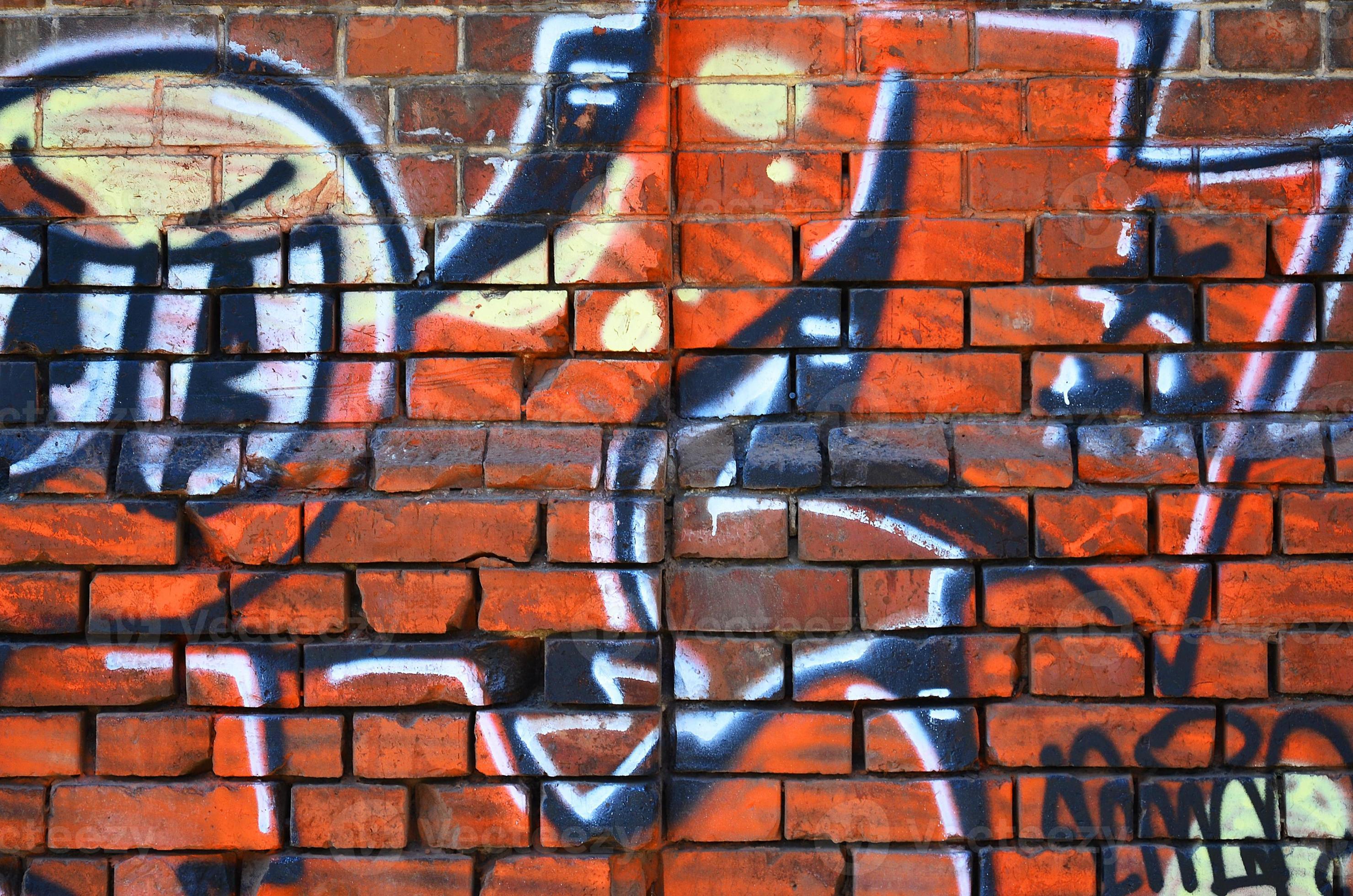 Fragment of an old colored graffiti drawing on the wall. Background