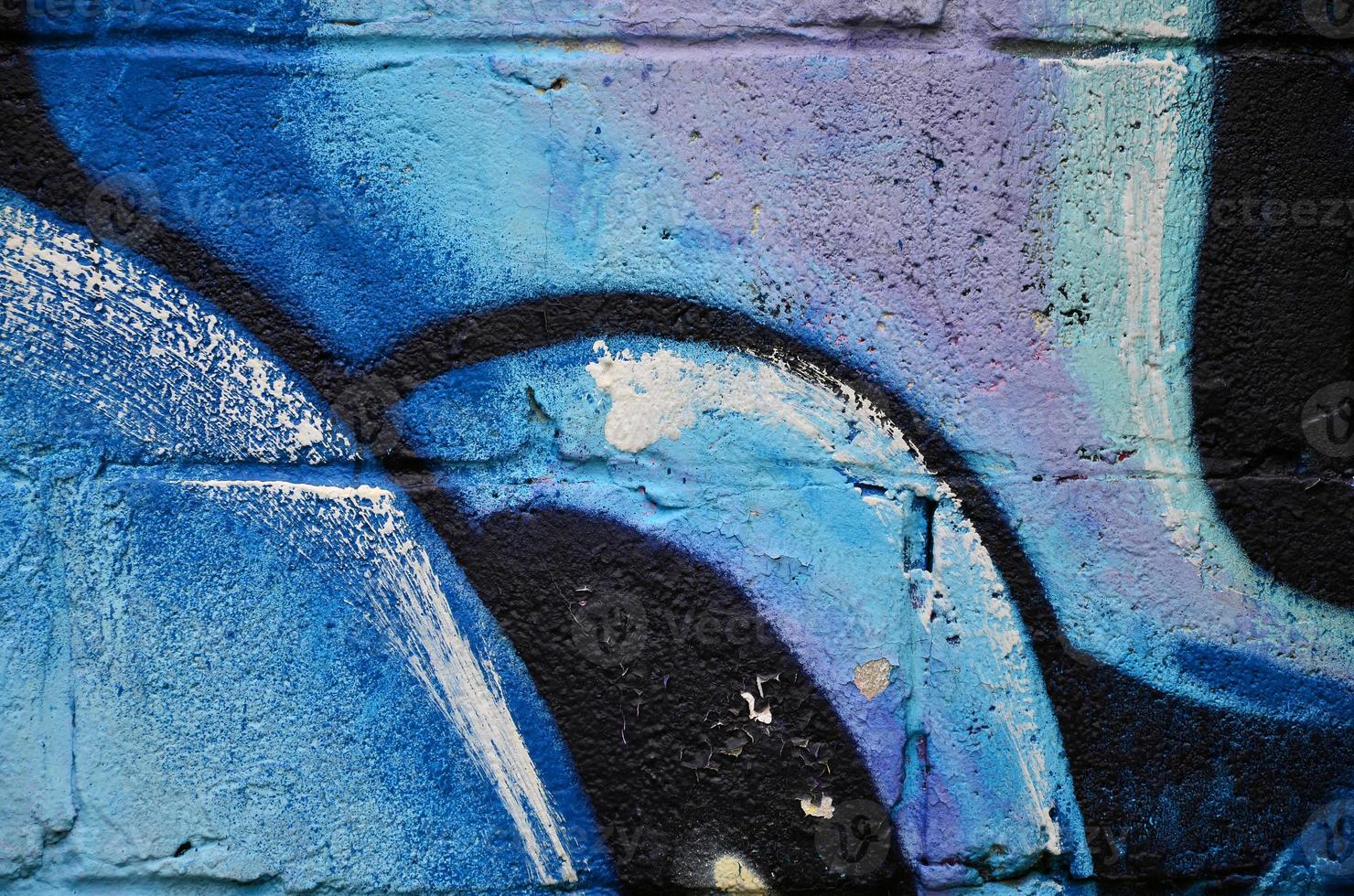 Background image of the wall decorated with colorful abstract graffiti. Street art concept photo