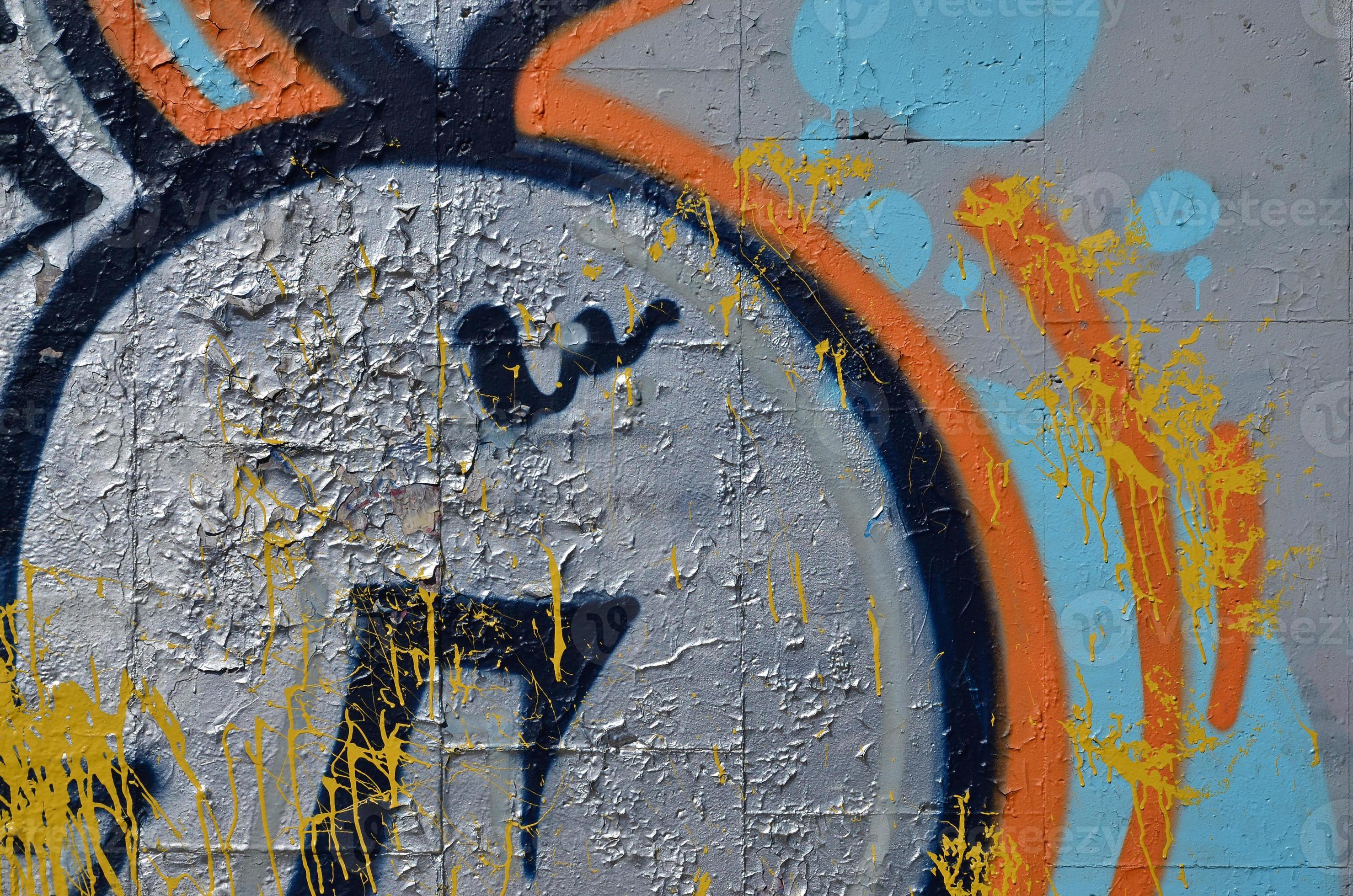 Fragment of an old colored graffiti drawing on the wall. Background