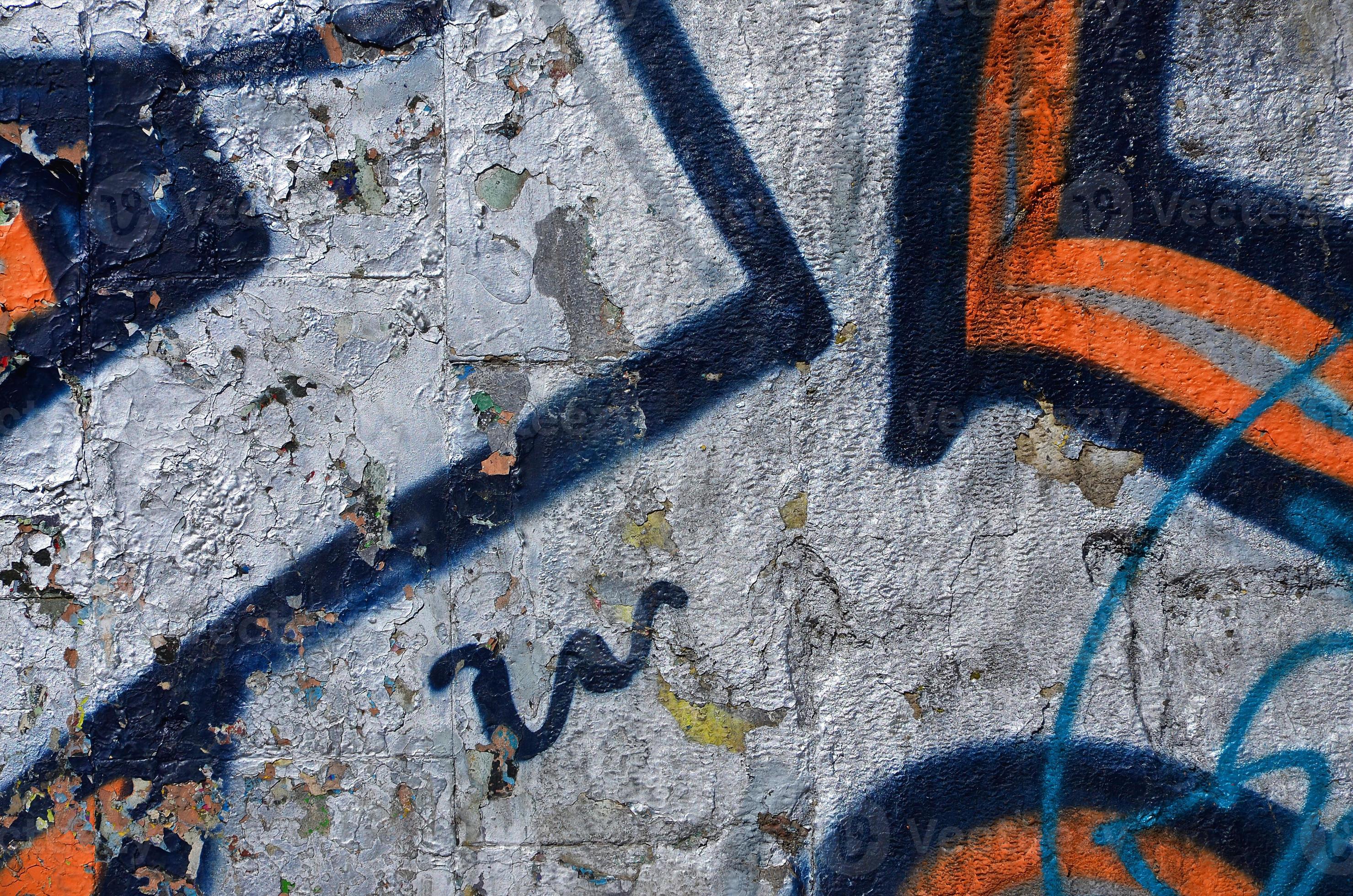 Fragment of an old colored graffiti drawing on the wall. Background