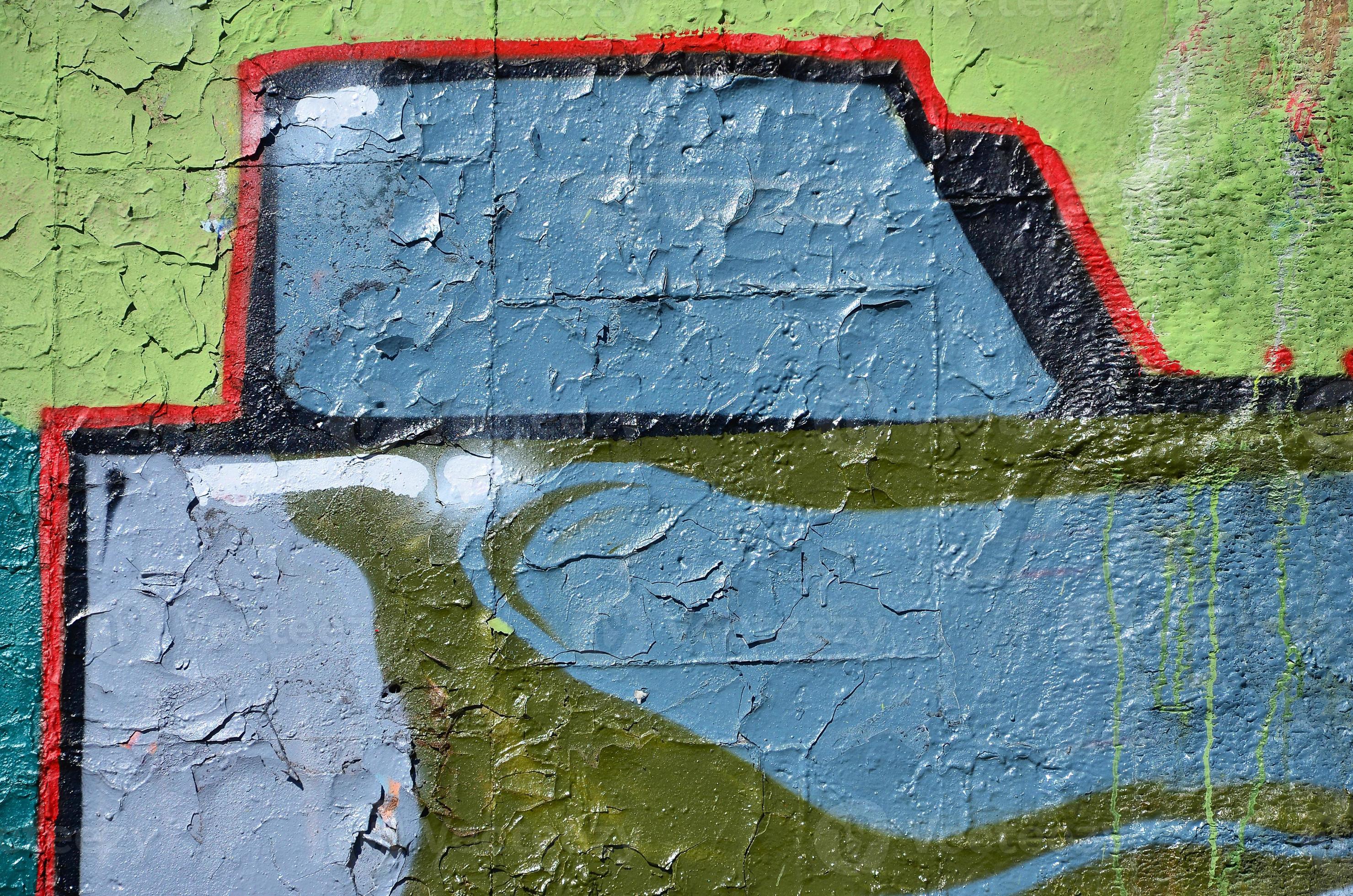 Fragment of an old colored graffiti drawing on the wall. Background