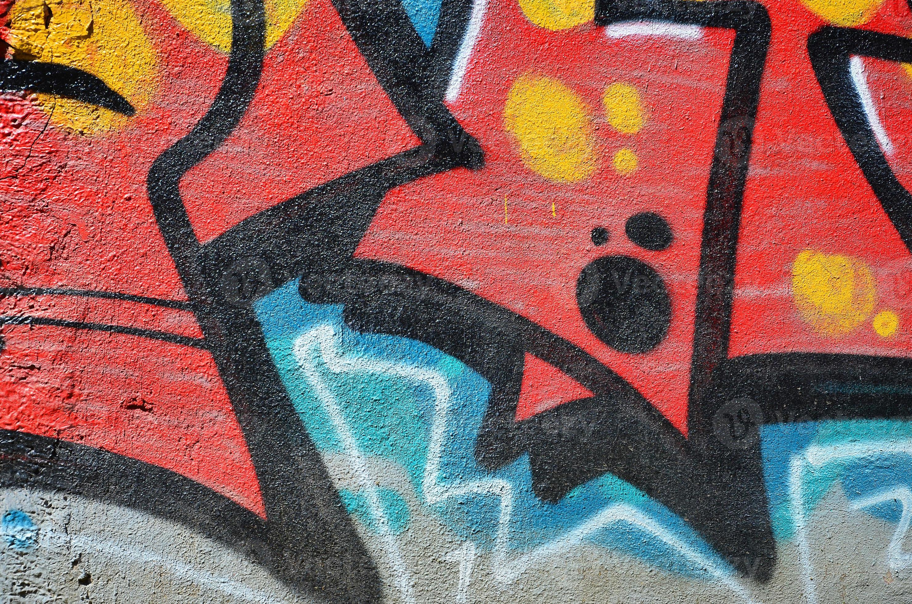 Fragment of an old colored graffiti drawing on the wall. Background