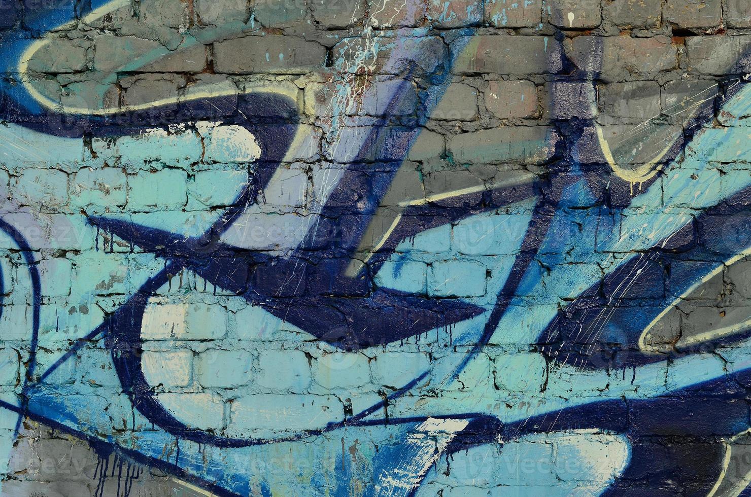Art under ground. Beautiful street art graffiti style. The wall is decorated with abstract drawings house paint. Modern iconic urban culture of street youth. Abstract stylish picture on wall photo