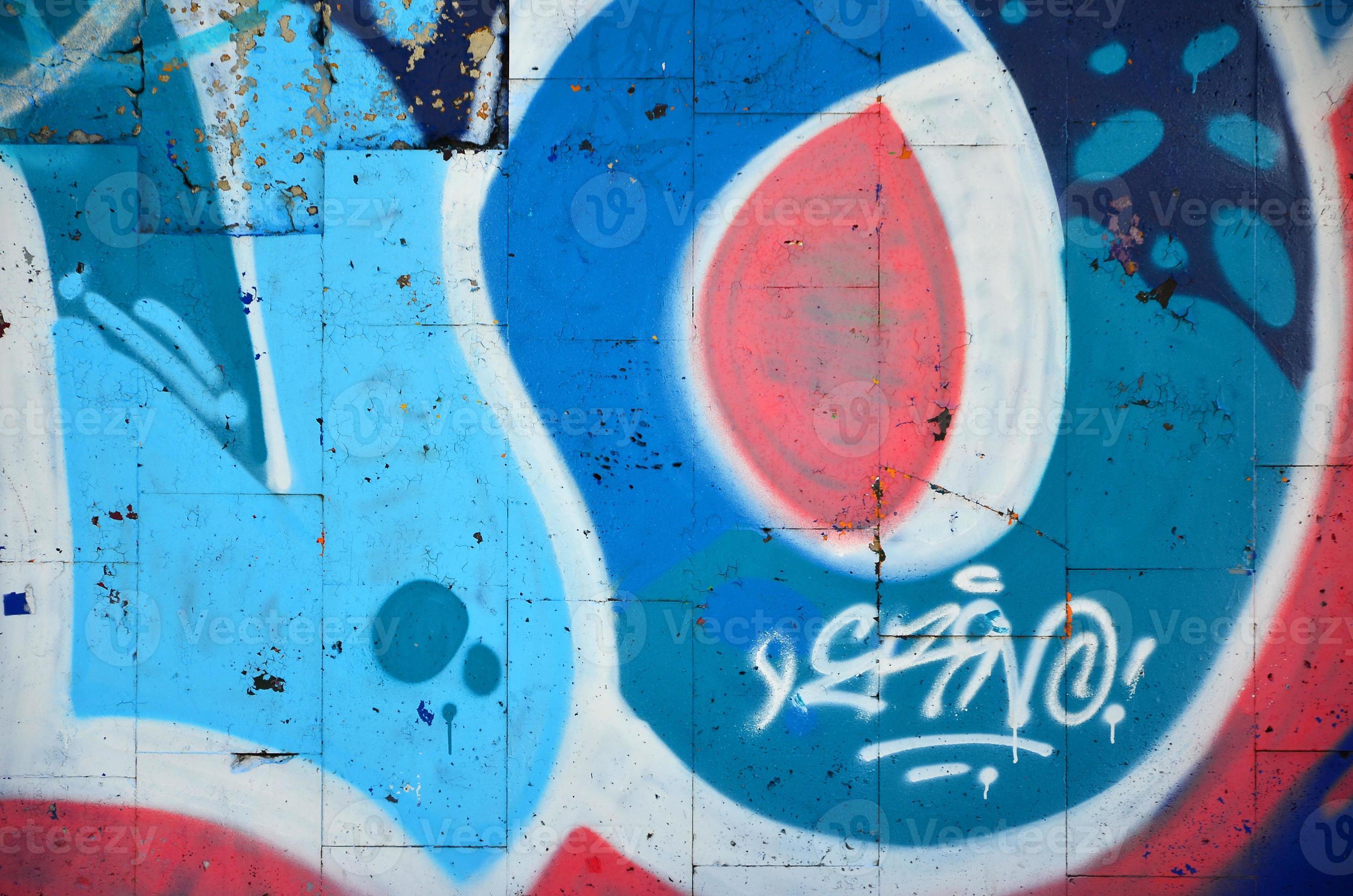 Fragment of an old colored graffiti drawing on the wall. Background