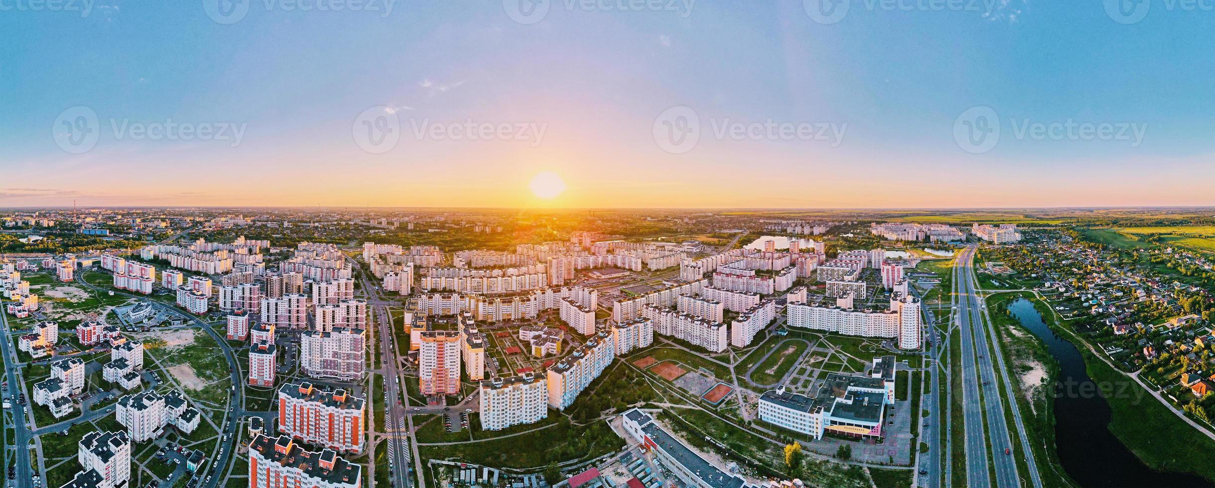 Aerial view of city residential district at sunset, panorama photo