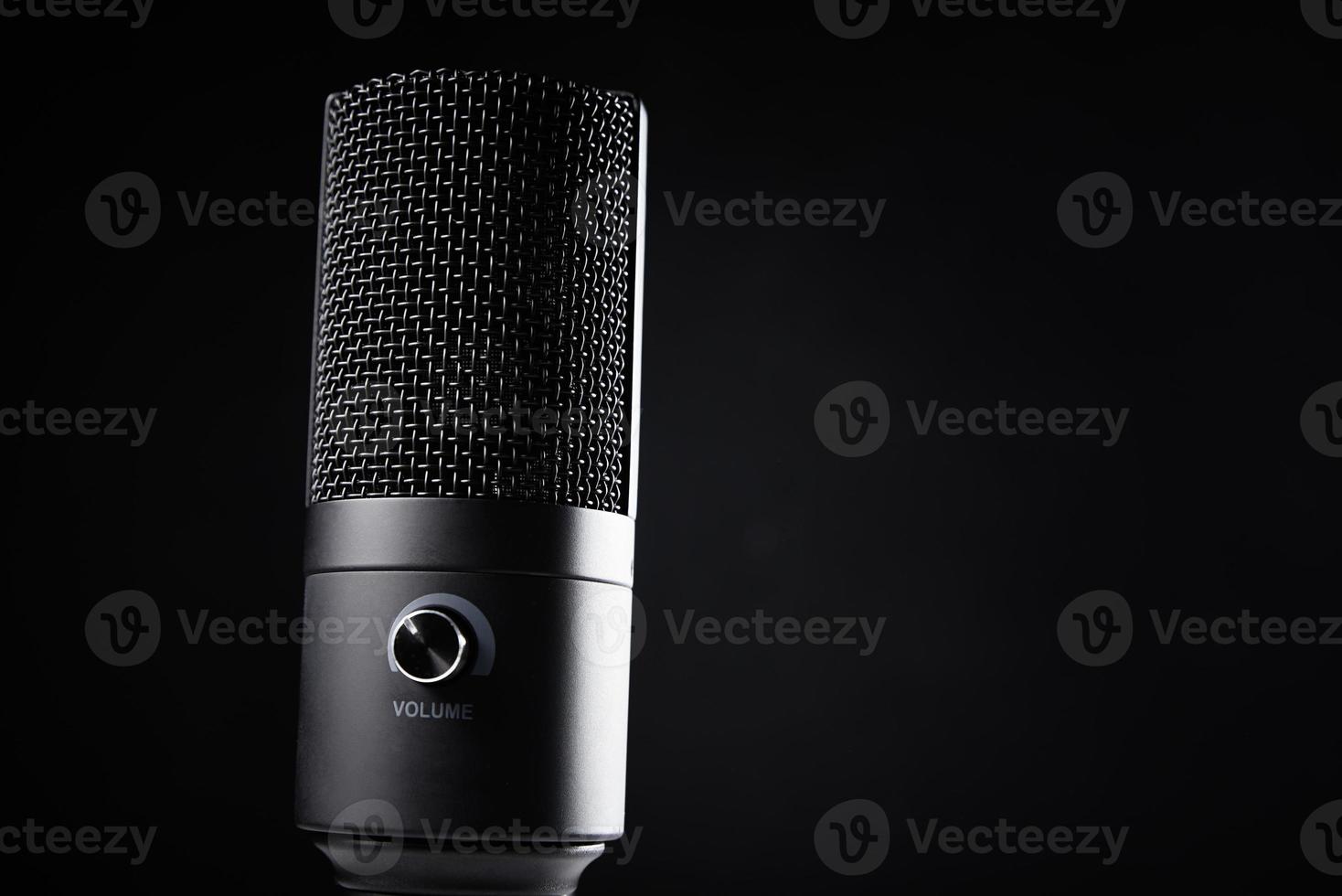 Studio microphone on dark background photo