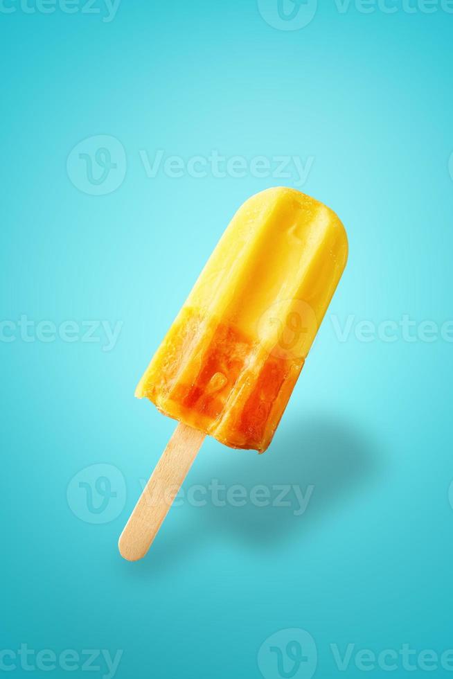 Frozen fruit ice cream on blue background photo