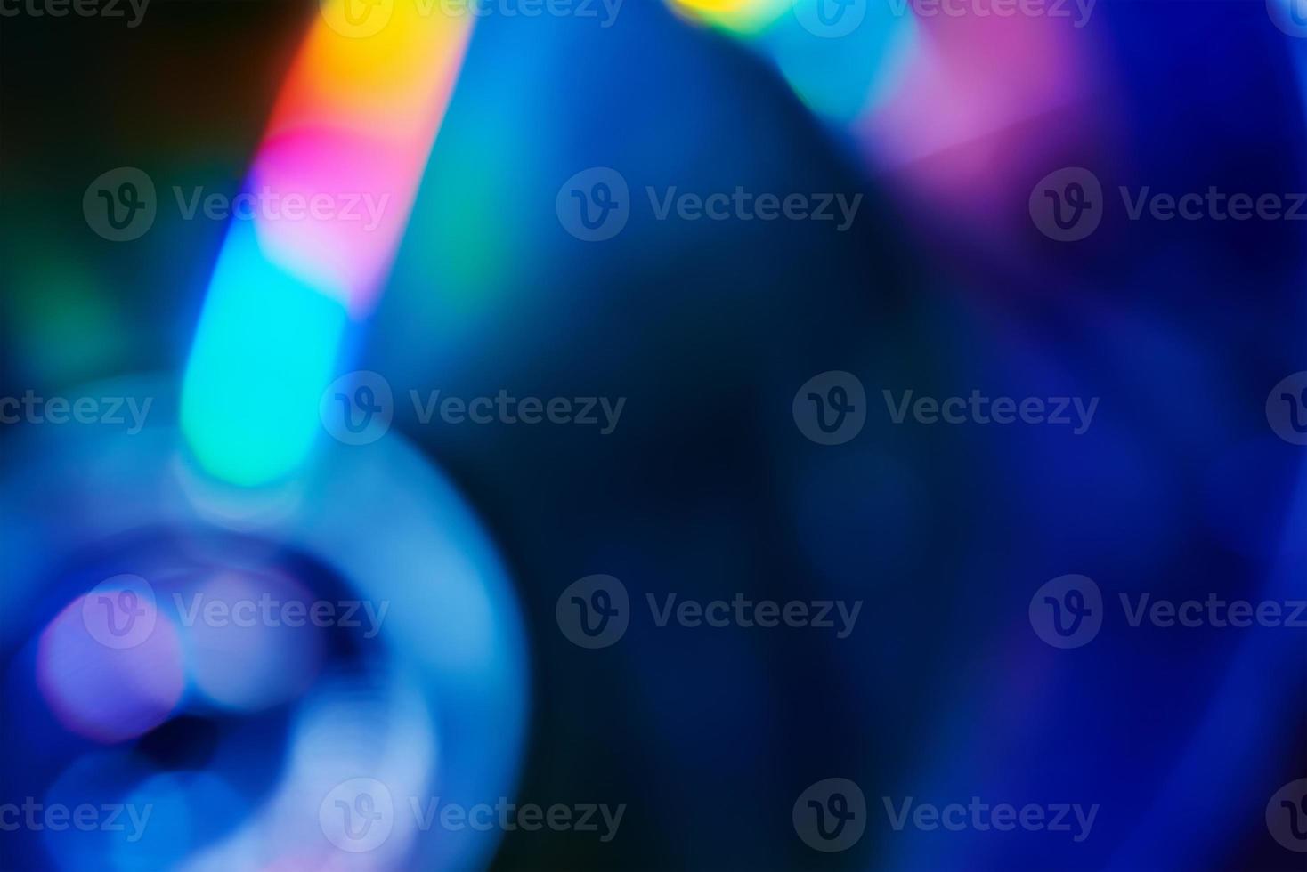 Blurred rainbow colored light flare background. photo