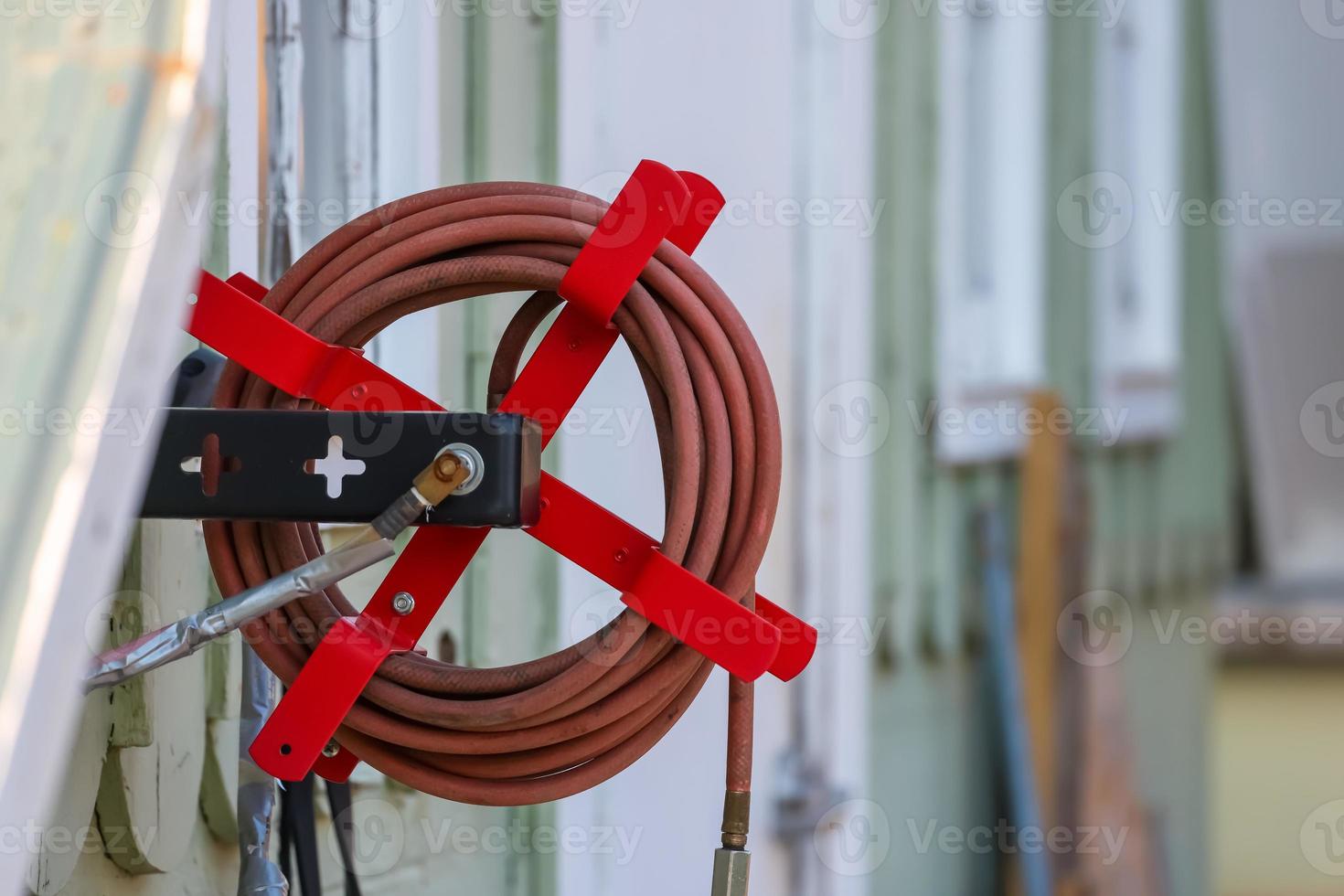 Close up view of air compressor hose holder. 17008460 Stock Photo
